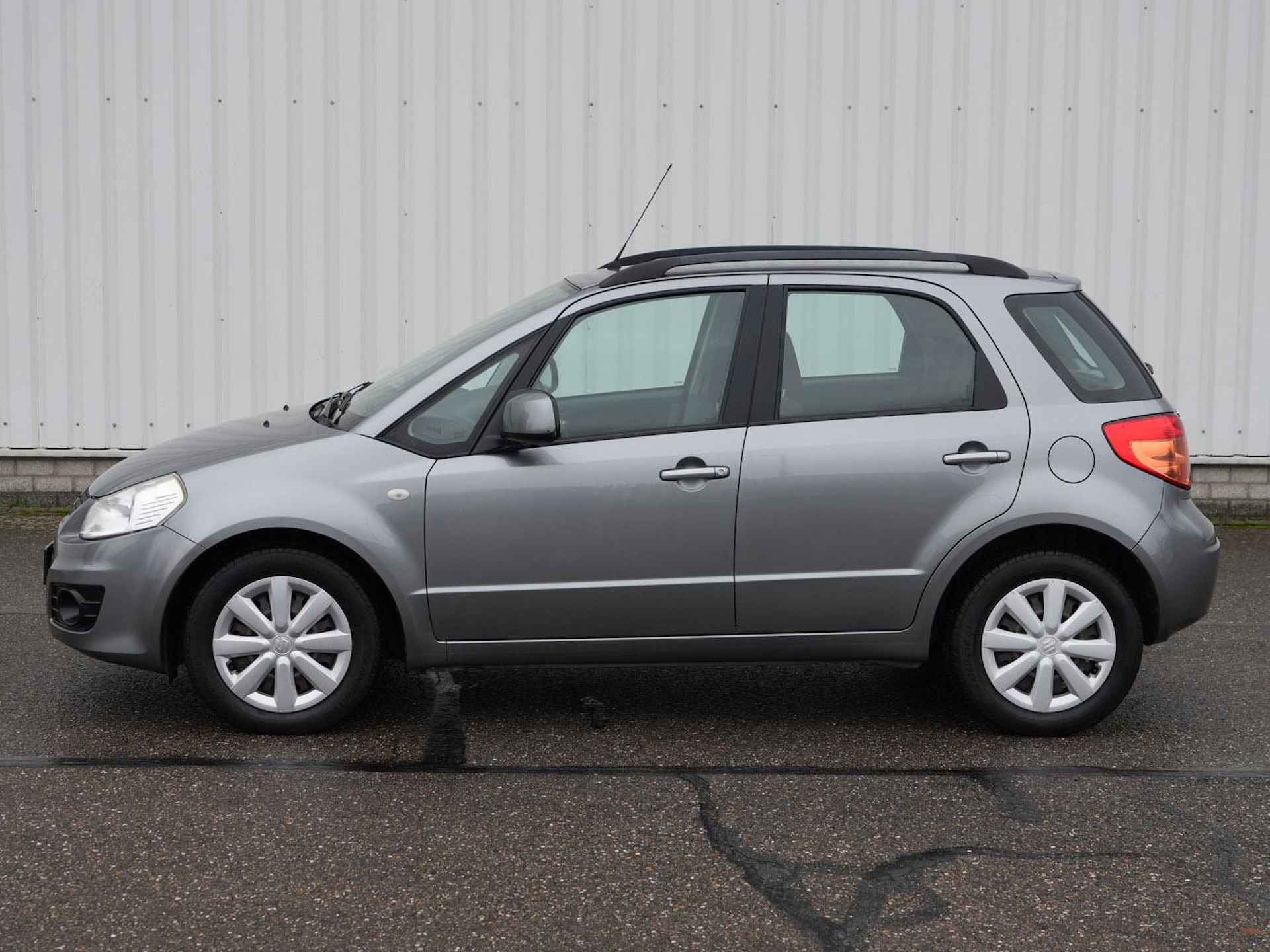 Suzuki SX4 1.6 Comfort | Airco | Radio CD MP3 | Dakrails | Stuurwielbediening | - 28/29