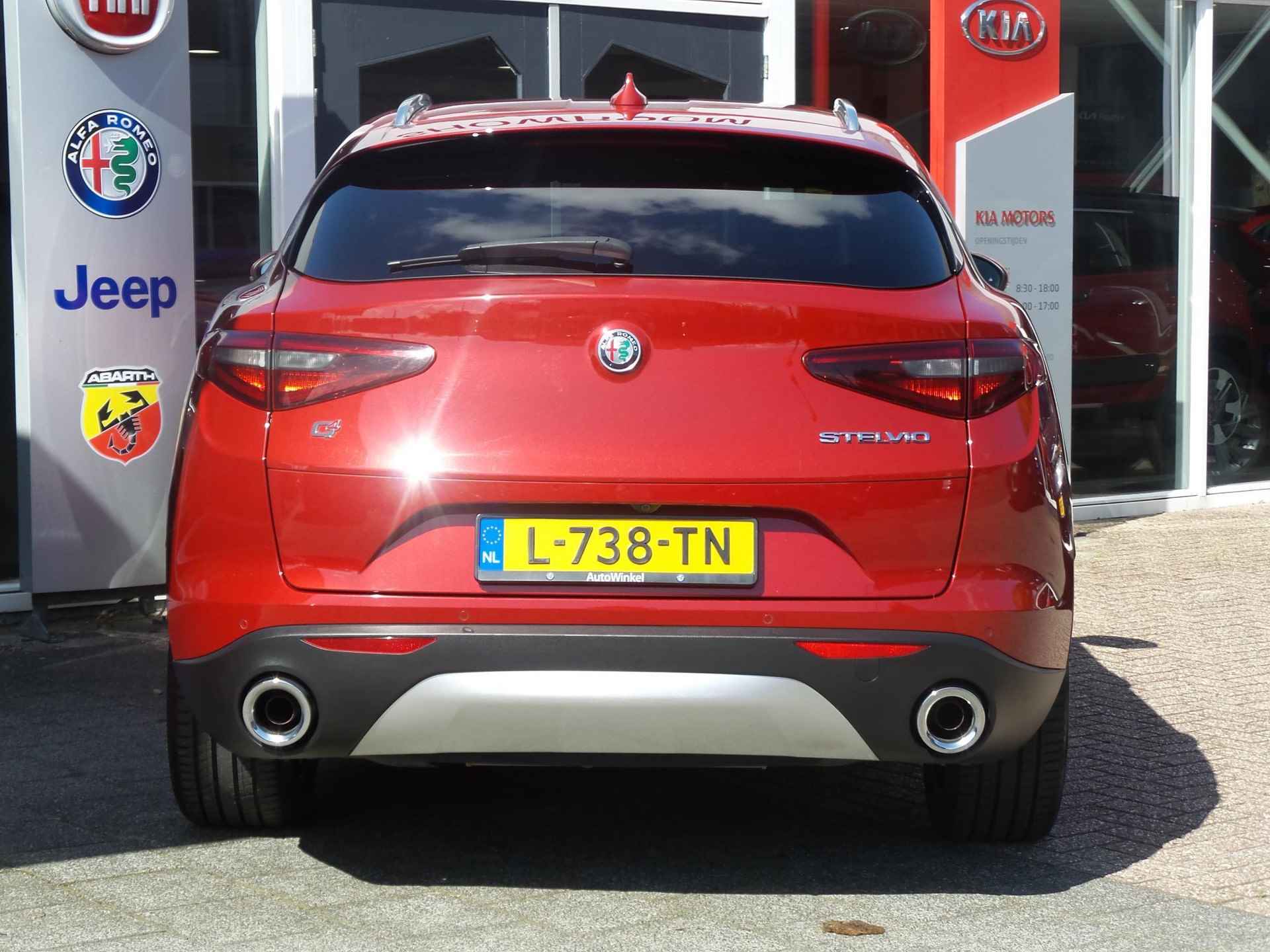 Alfa Romeo Stelvio 2.0 Turbo Aut. AWD 280pk Super | Veloce Int. Pack | Adapt. Cruise | Xenon | Dakrails | Apple Carplay | BSM | Achterbank Verwarming | Rosso Comp. - 4/30