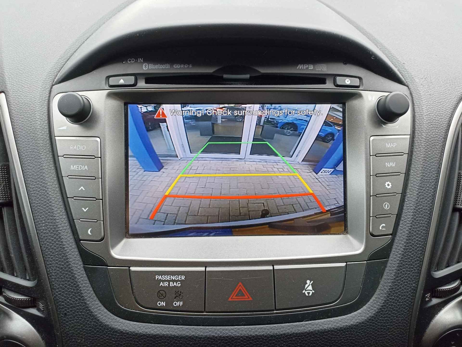 Hyundai ix35 1.6i GDI Go! 17"LM Velgen | Navigatie | PDC Achter | Panorama dak | Trekhaak | Stoelverwarming | - 12/28