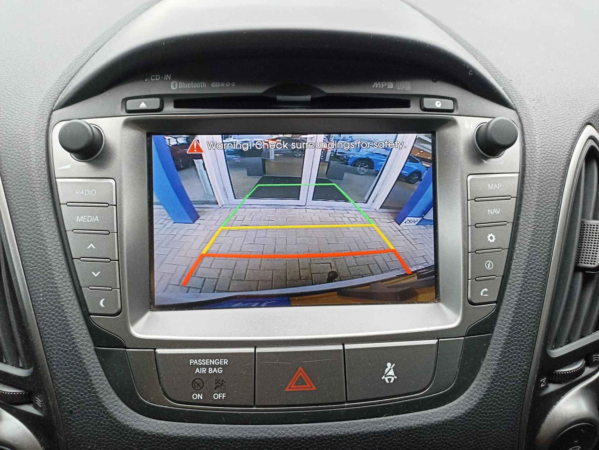 Hyundai ix35 1.6i GDI Go! 17"LM Velgen | Navigatie | PDC Achter | Panorama dak | Trekhaak | Stoelverwarming | - 14/28