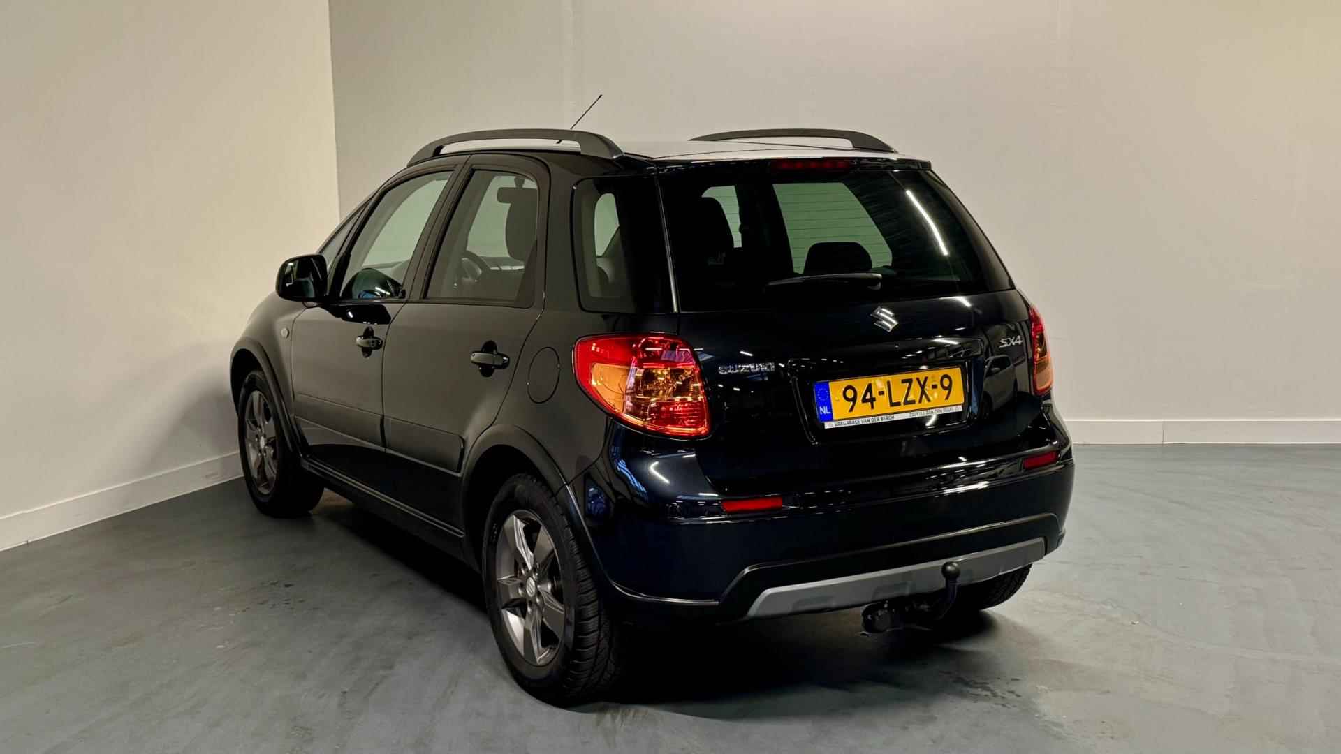 Suzuki SX4 1.6 Limited | NL-AUTO | 1E EIGENAAR | TREKHAAK | PARROT | - 9/30