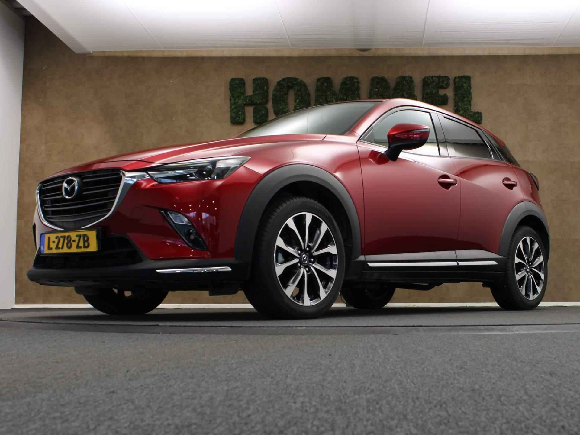 Mazda CX-3 2.0 SkyActiv-G 120 GT-M -NAVIGATIE - VASTE TREKHAAK- TREKGEWICHT 1200 KG- CLIMATE CONTROL - HEAD UP DISPLAY - VOORSTOELEN VERWARMD - PARKEERSENSOREN VOOR/ ACHTER - BLUETOOTH - 18 INCH LICHT METALEN VELGEN - 13/42