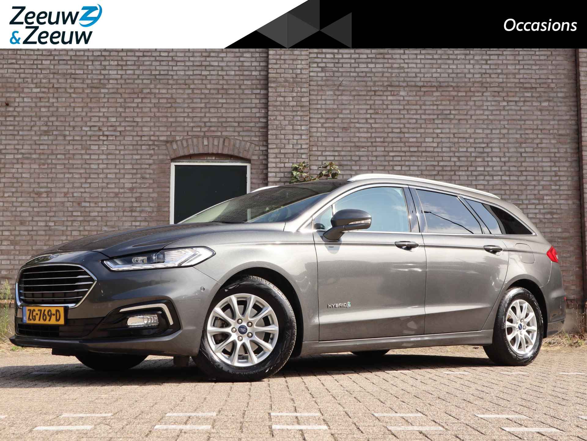 Ford Mondeo Wagon 2.0 IVCT HEV Titanium | Adaptieve Cruise Control | Winterpack | El. Trekhaak | Dodehoek detectie | El. stoelen met geheugenfunctie | El. Achterklep | Climate control | Achteruitrijcamera | SONY Audio | Led koplampen | - 1/54