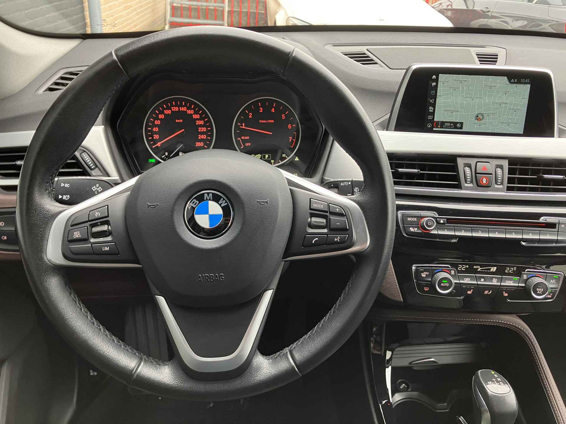 BMW X1 xDrive20i 192 pk High Executive AUT. | dealer onderhouden | cruise control | navigatie | bruin leder interieur | sportstoelen - 23/38