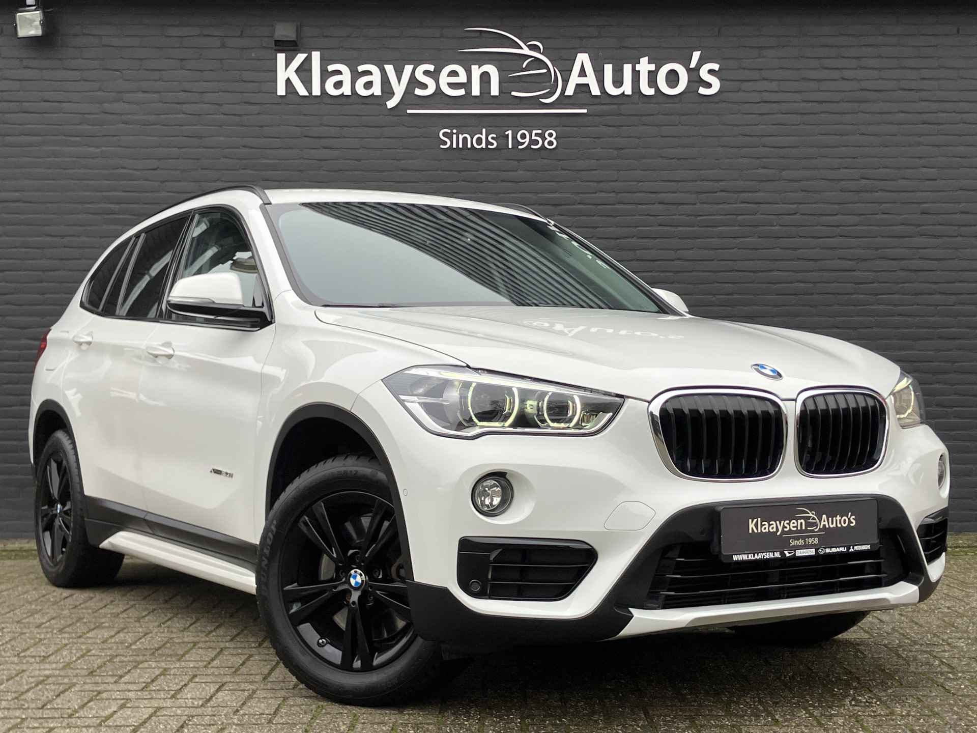 BMW X1 xDrive20i 192 pk High Executive AUT. | dealer onderhouden | cruise control | navigatie | bruin leder interieur | sportstoelen - 4/38