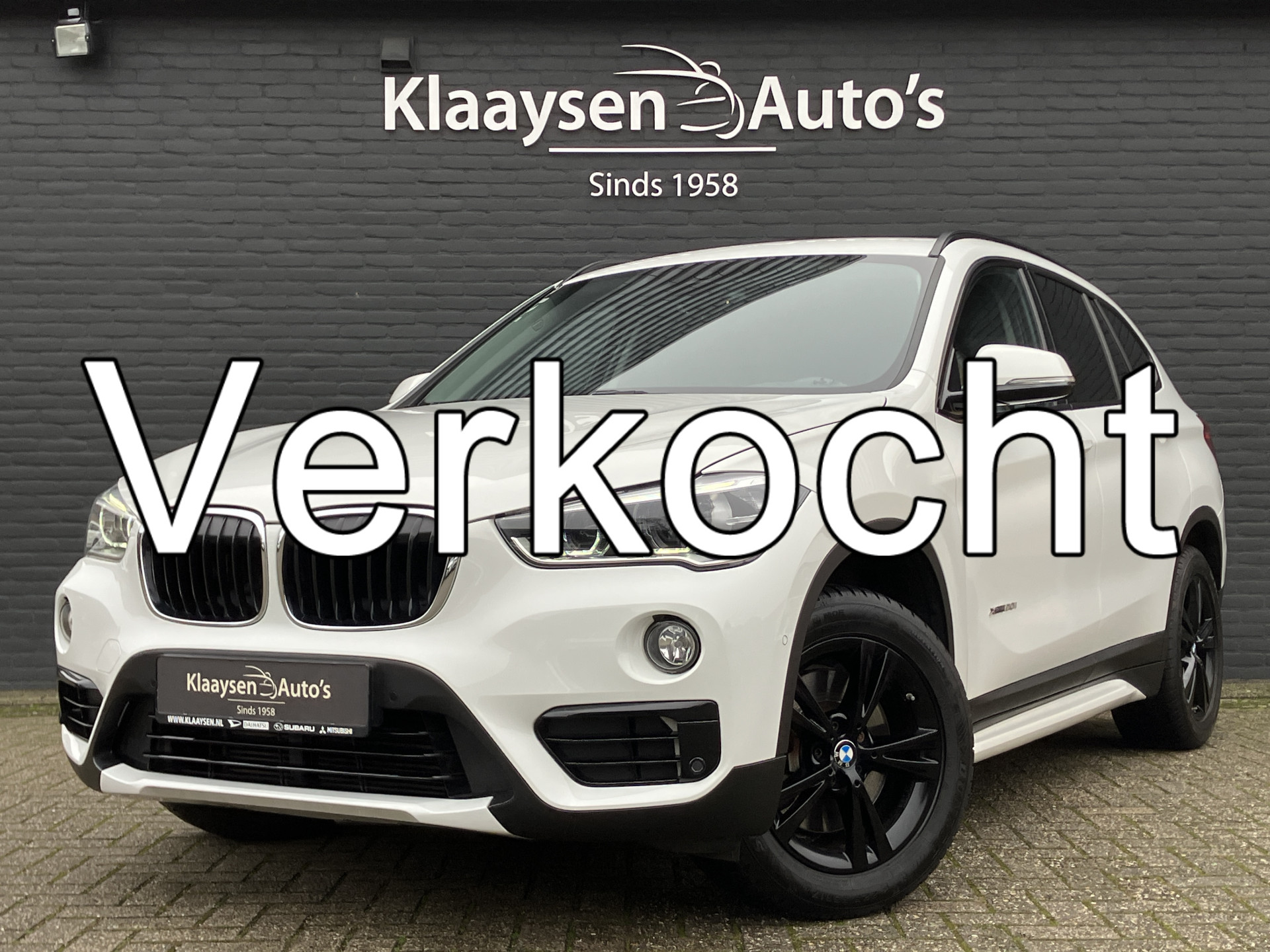 BMW X1 xDrive20i 192 pk High Executive AUT. | dealer onderhouden | cruise control | navigatie | bruin leder interieur | sportstoelen