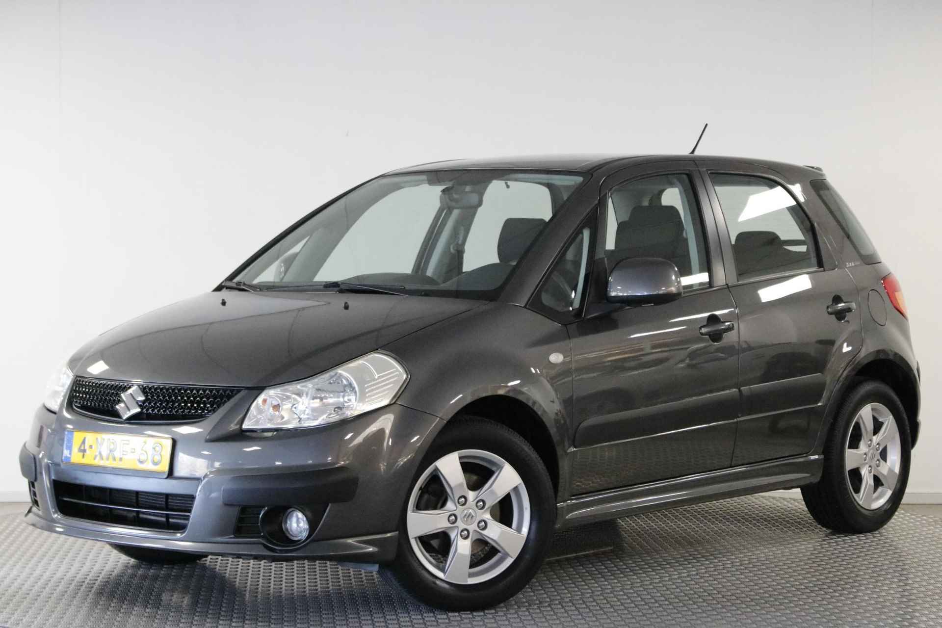 Suzuki SX4 1.6 Comfort. Climate | Cruise | Lichtmetaal | Elektrische ramen | Trekhaak. - 27/30