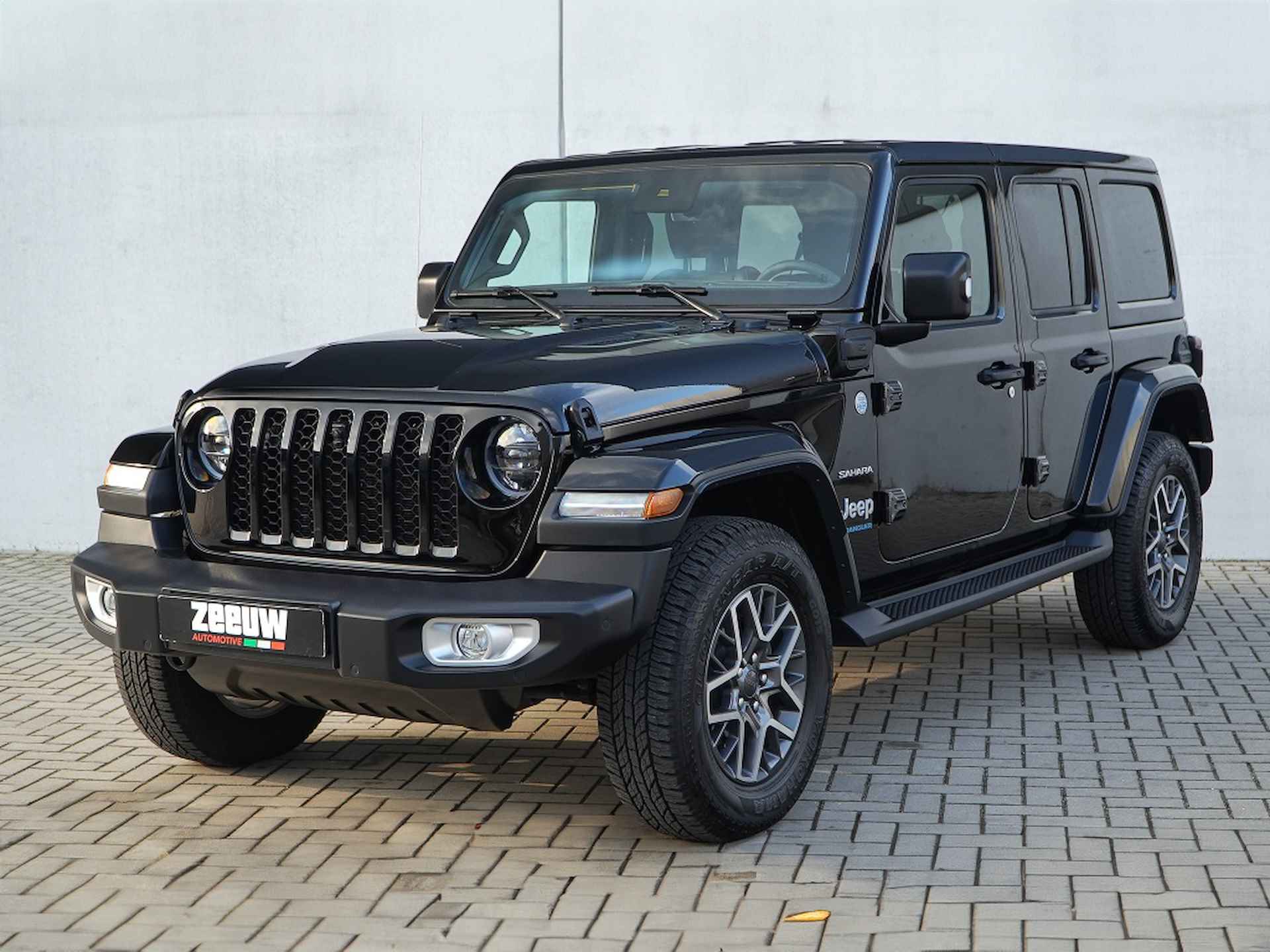 Jeep Wrangler Unlimited  4xe 380 PK Sahara | Leder | Camera | Navi | 18" - 7/35