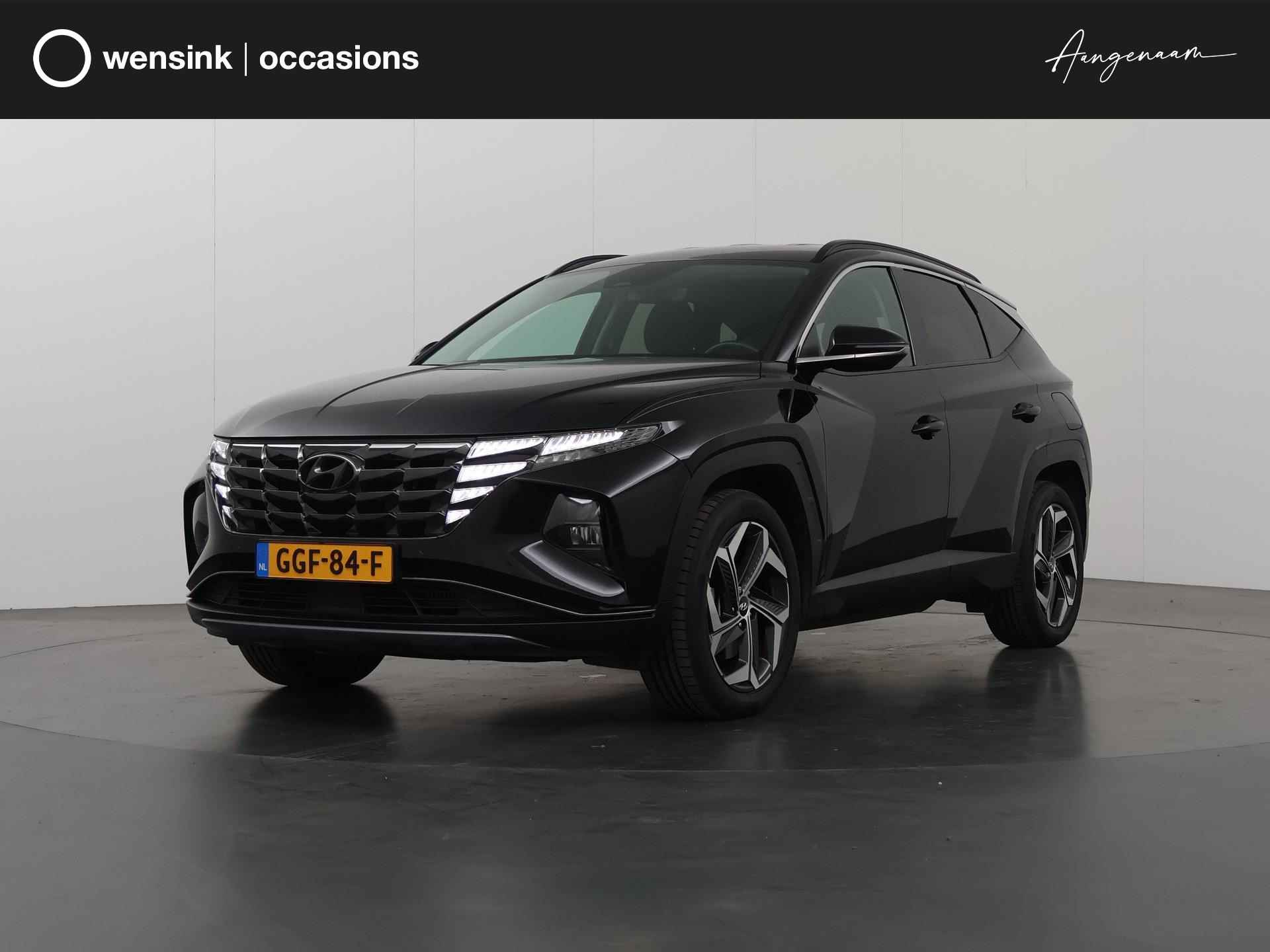 Hyundai Tucson 1.6 T-GDI PHEV Comfort 4WD | LED | DAB | Navigatie | Bluetooth | Climate Control | Cruise Control | Camera | Privacy Glass | Apple CarPlay | Stoelverwarming | - 1/37