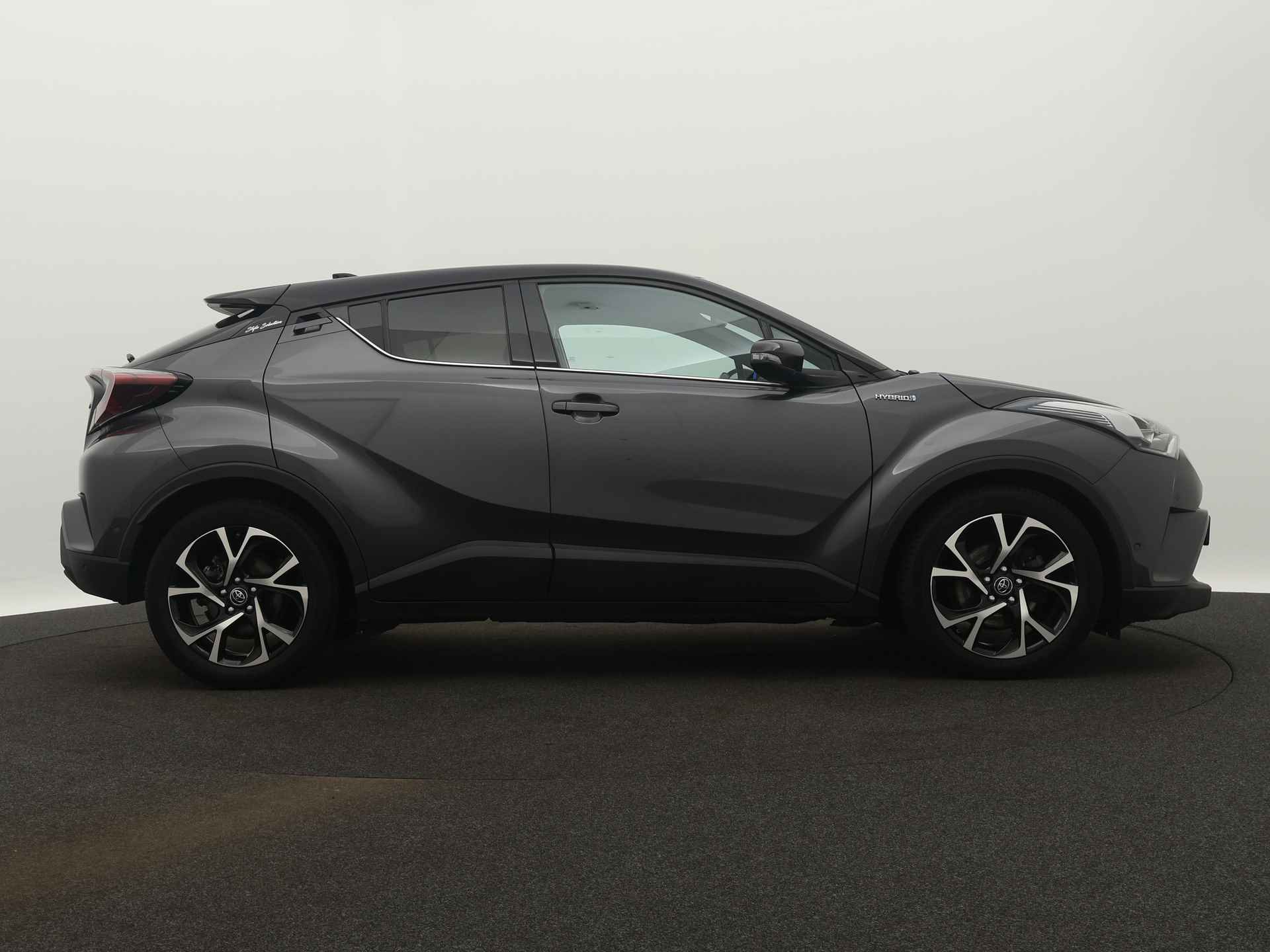 Toyota C-HR 1.8 Hybrid Bi-tone Plus Limited | Navigatie | Camera | LM velgen | Climate Control | Leder | Stoel en stuurwiel verwarmd | - 16/43