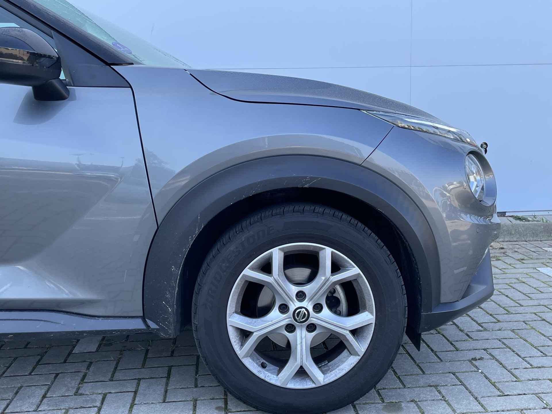 Nissan Juke 1.0 DIG-T 114 N-Connecta / Navigatie / Climate Control / Lichtmetalen Velgen / Privacy Glass / LED - 19/28