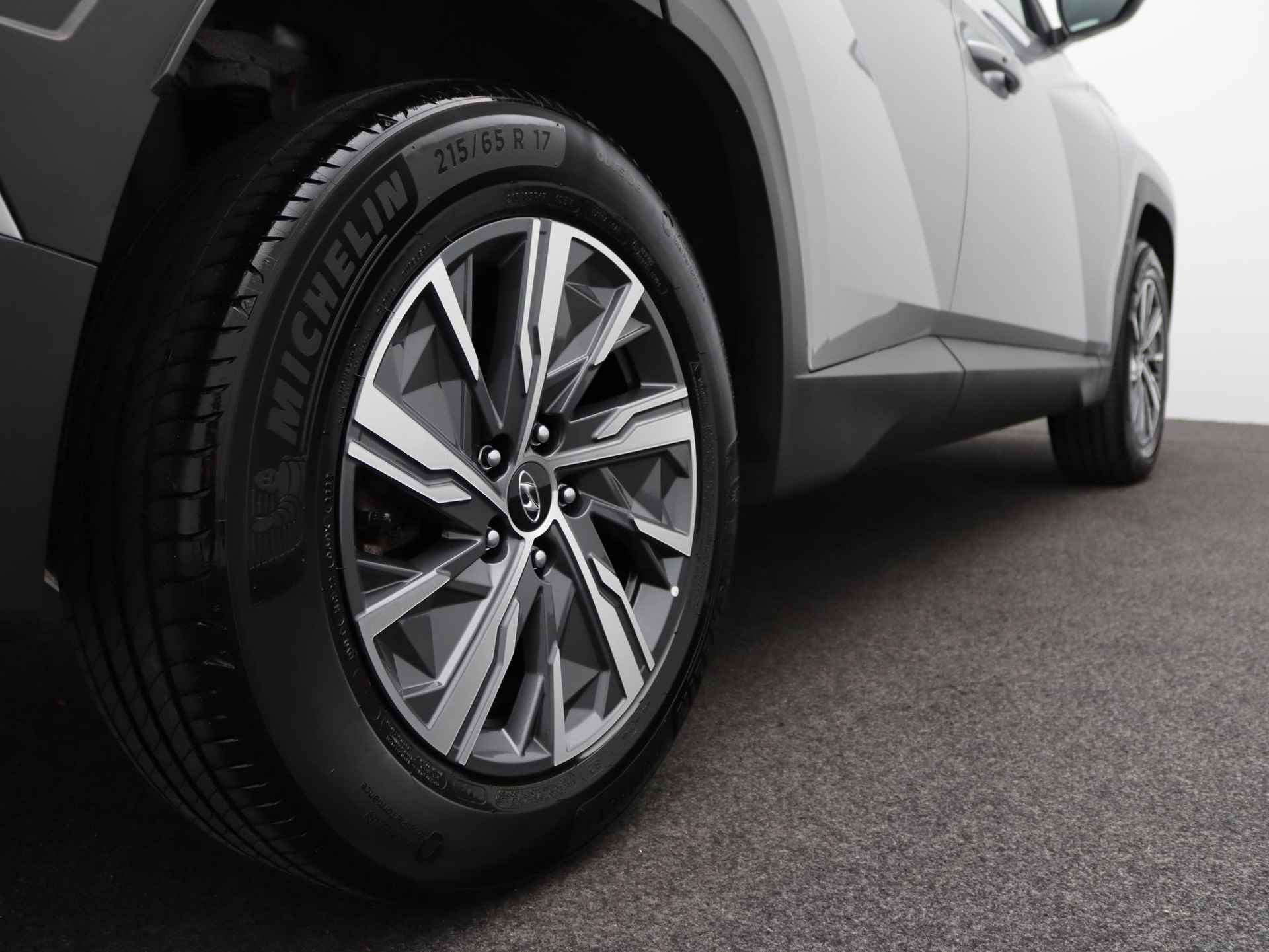 Hyundai Tucson 1.6 T-GDI HEV Comfort Smart | Hybride | Navigatie | Stoelverwarming | LED | DAB | Cruise Control | Achteruitrijcamera | Stuurverwarming | - 39/48