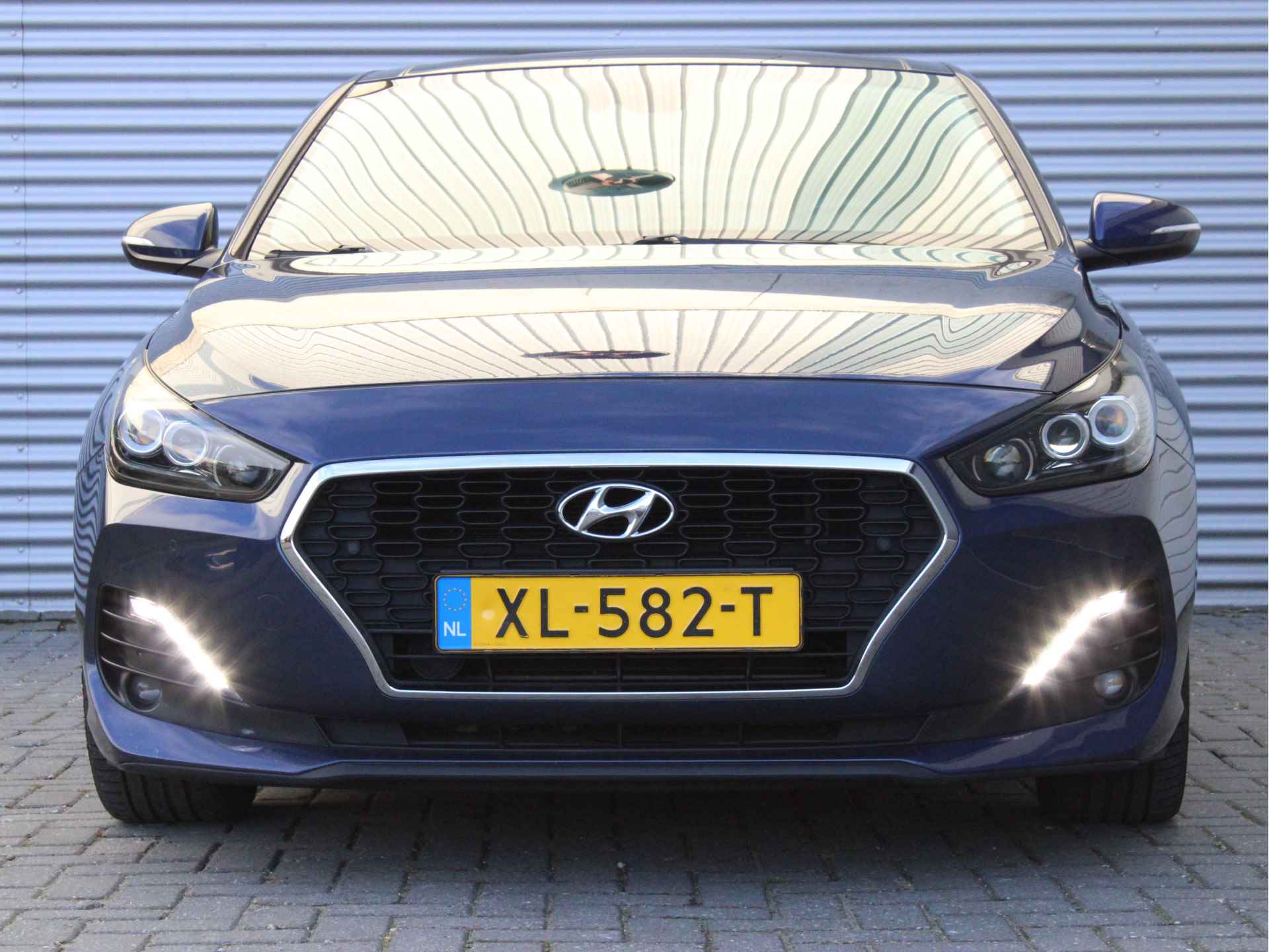 Hyundai i30 Fastback 1.4 T-GDI Premium Sky 140pk Automaat | Schuif-/Kanteldak | Vol-Leder | Navigatie | Elektr. Stoelen | Achteruitrijcamera - 4/23