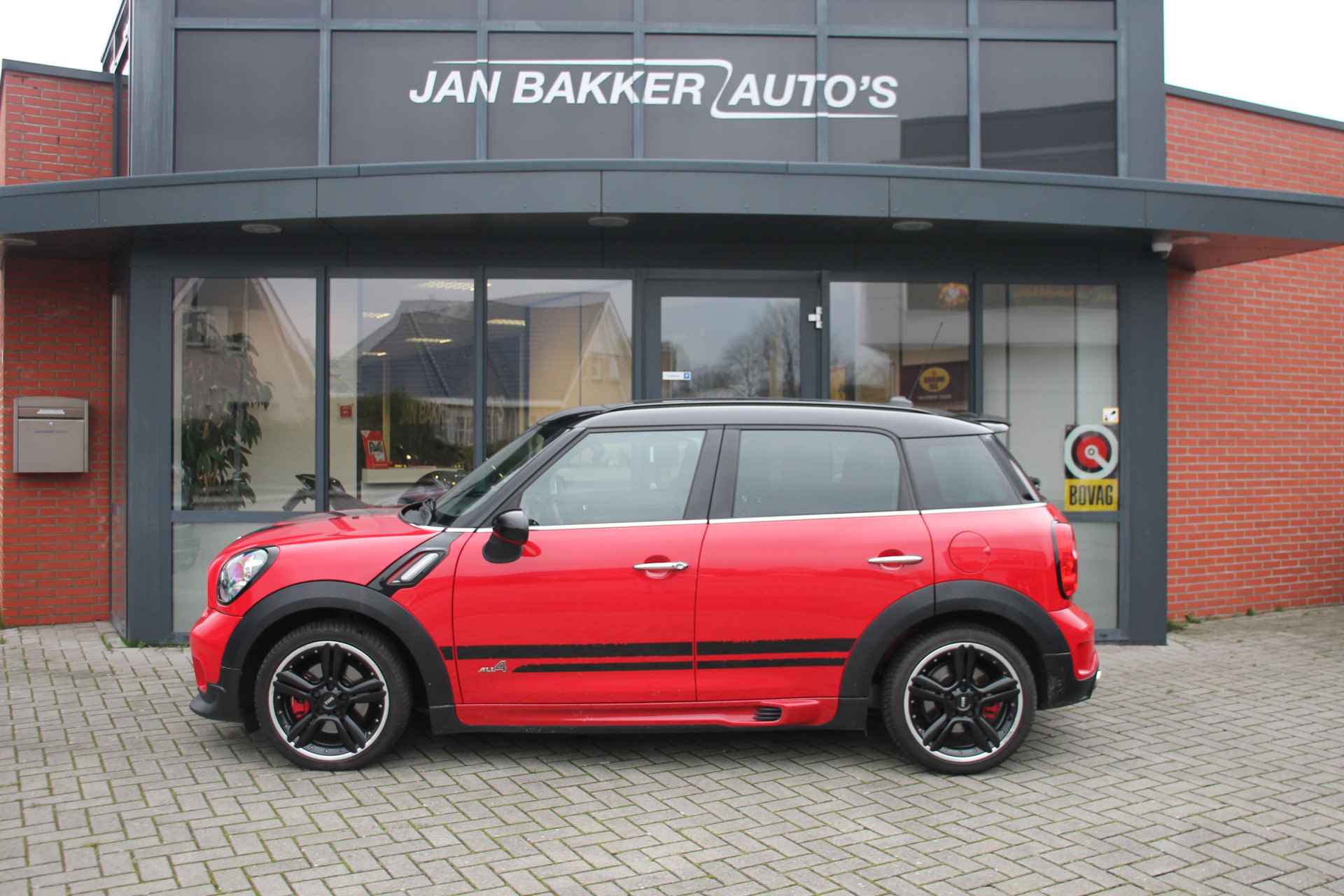 MINI Countryman 1.6 John Cooper Works ALL4 Chili ✅ Panoramadak ✅ Navi ✅ 218PK ✅ jaar garantie - 3/23