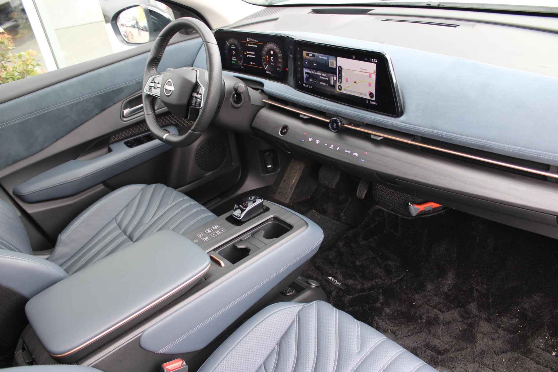 Nissan Ariya e-4ORCE Evolve 91 kWh 306PK AUTOMAAT | Schuif/Kantel dak | 360-Camera | Parkeersensoren | Adaptive cruise control | Stoelwarwarming voor/achter | Stuur/Voorruitverwarming | Elektrische voorstoelen met geheugen | Elektrische achterklep | Head-up display | Navigatie | - 25/80