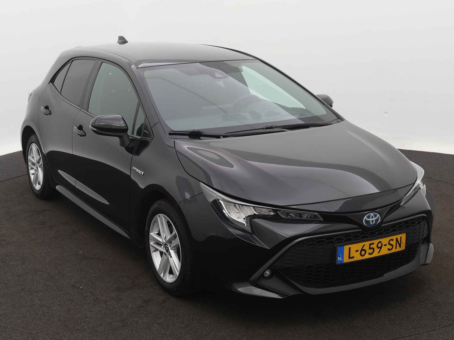 Toyota Corolla 1.8 Hybrid Active | Stoel en stuurwiel verwarmd | Draadloze telefoonlader | LM velgen | Camera | Climate Control | Head-up display | - 29/43