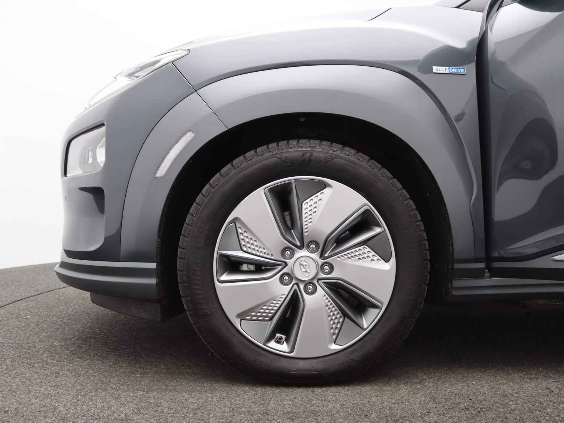 Hyundai Kona EV Premium 64 kWh | Airco | Navigatie | Achteruitrijcamera | Cruise Control | Lederen bekleding | - 14/46