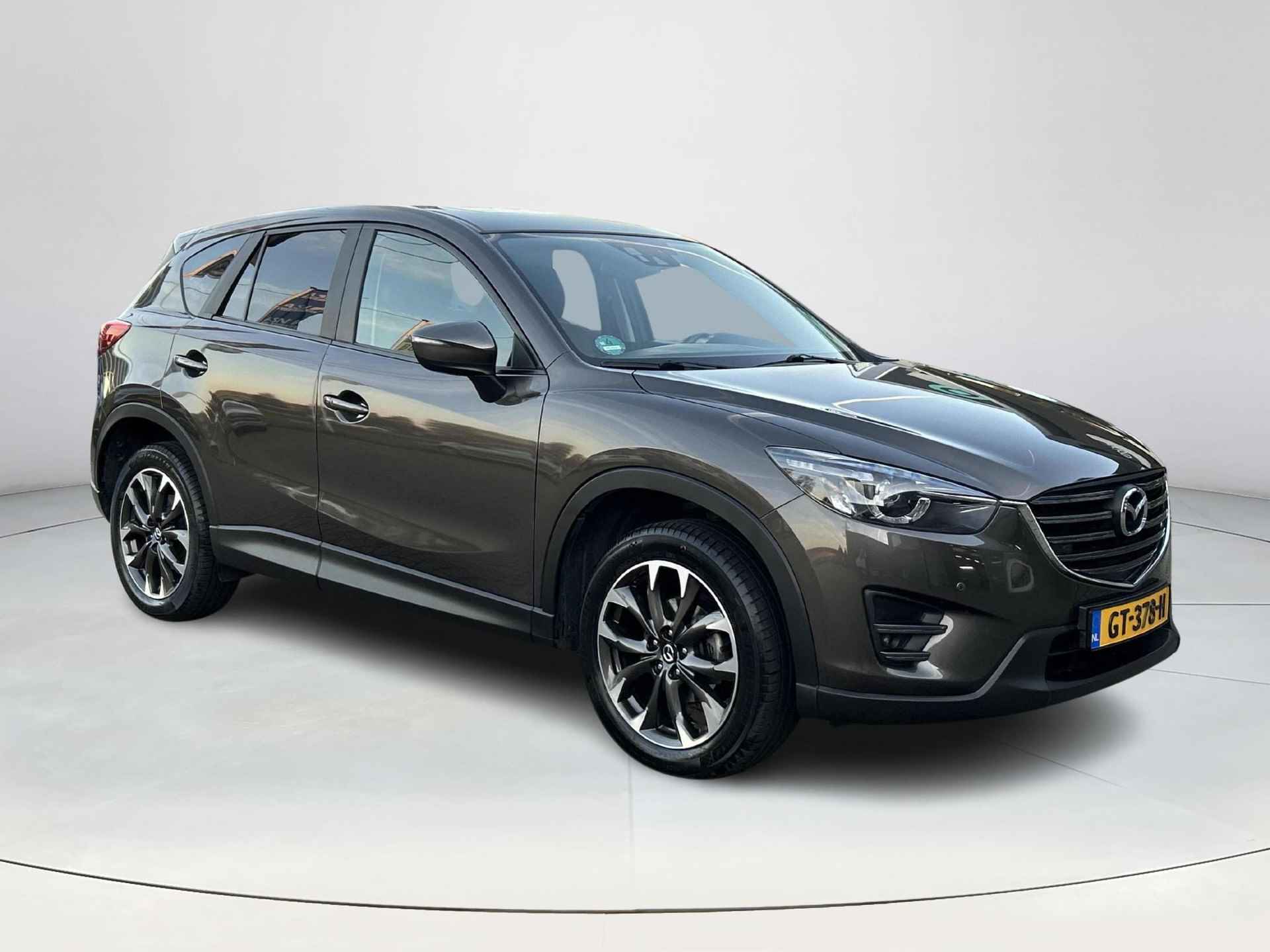 Mazda CX-5 2.0 SkyActiv-G 160 GT-M 4WD Automaat | Rijklaarprijs! | Trekhaak 1.800kg! |  Lage km-stand! | Schuifdak |  Climate Control | Navi | Leder | Stoelverwarming | Elektrische stoelen met geheugen | Inclusief 12 maanden Bovag-garantie! | - 8/28