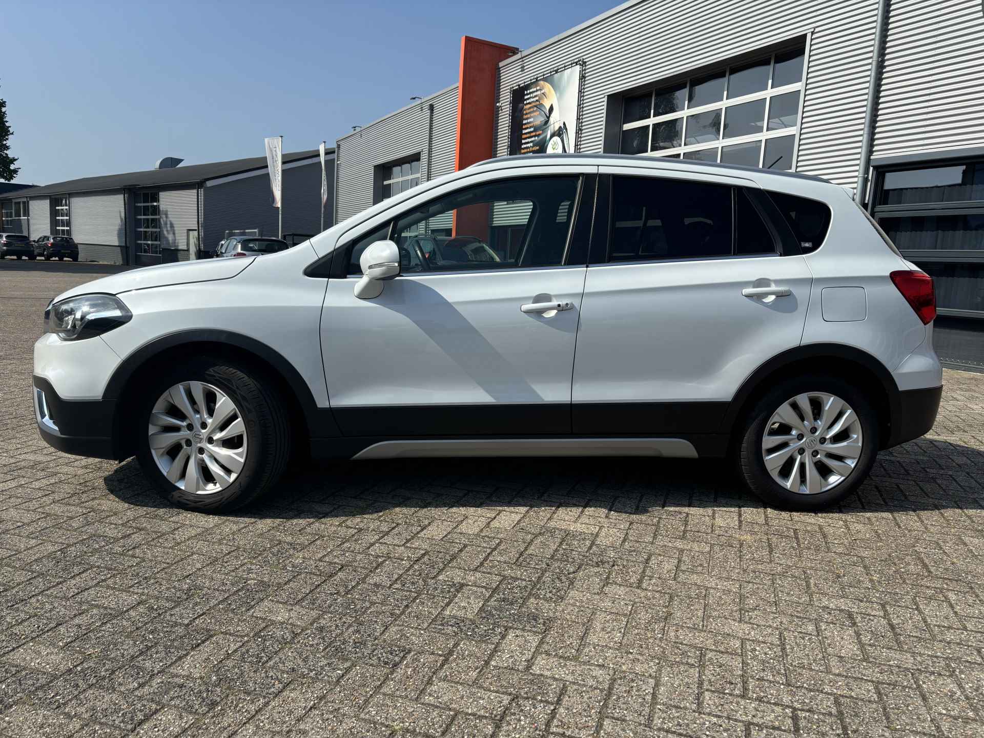 Suzuki S-Cross 1.4 Boosterjet Exclusive NL-Auto 1e eigenaar / Trekhaak / Camera / Navigatie / Parelmoer kleur - 4/24