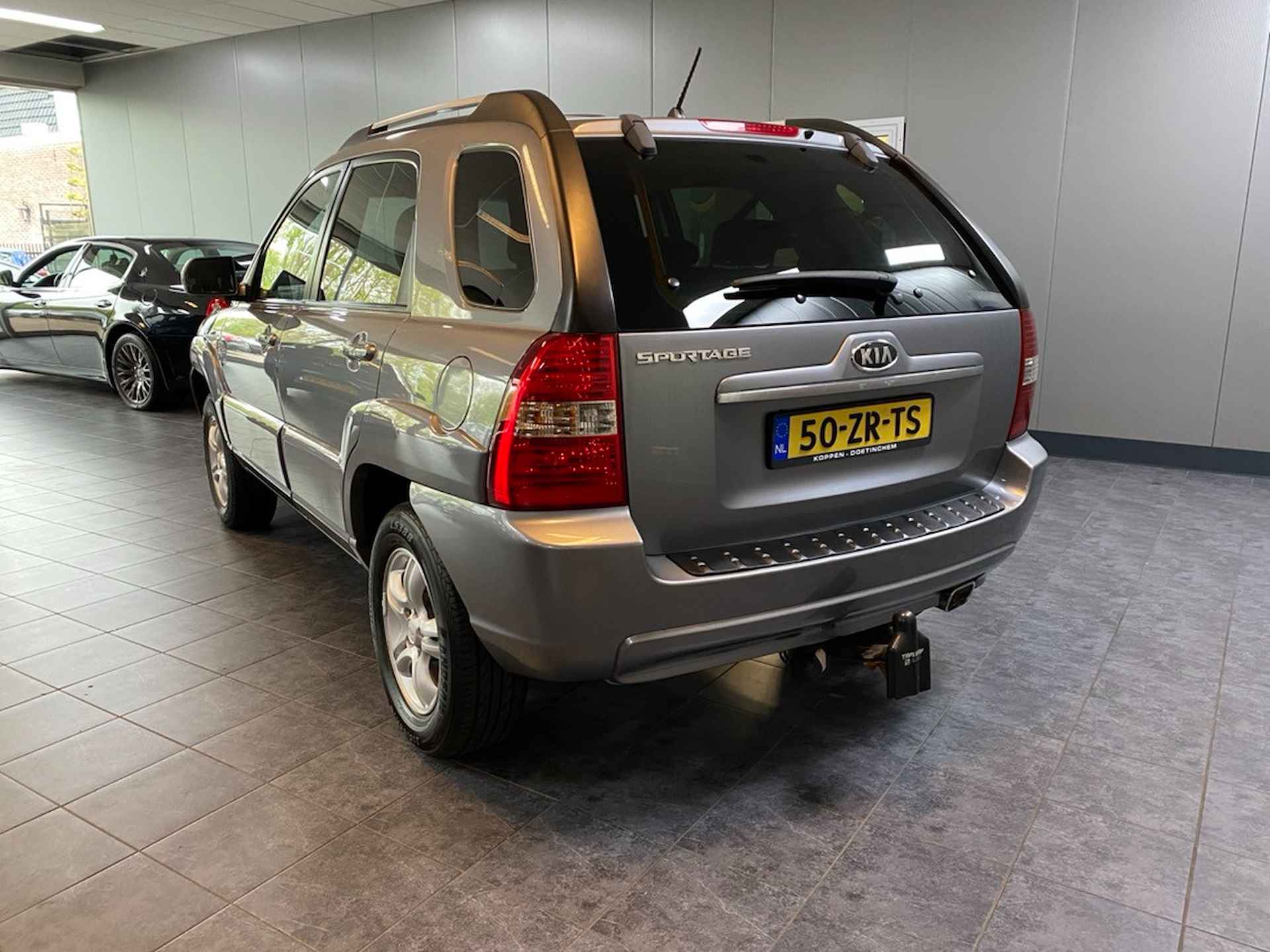 Kia Sportage 2.0 CVVT X-ception In nieuwstaat, Lederen bekleding, Climate control, Cruise control. - 3/19