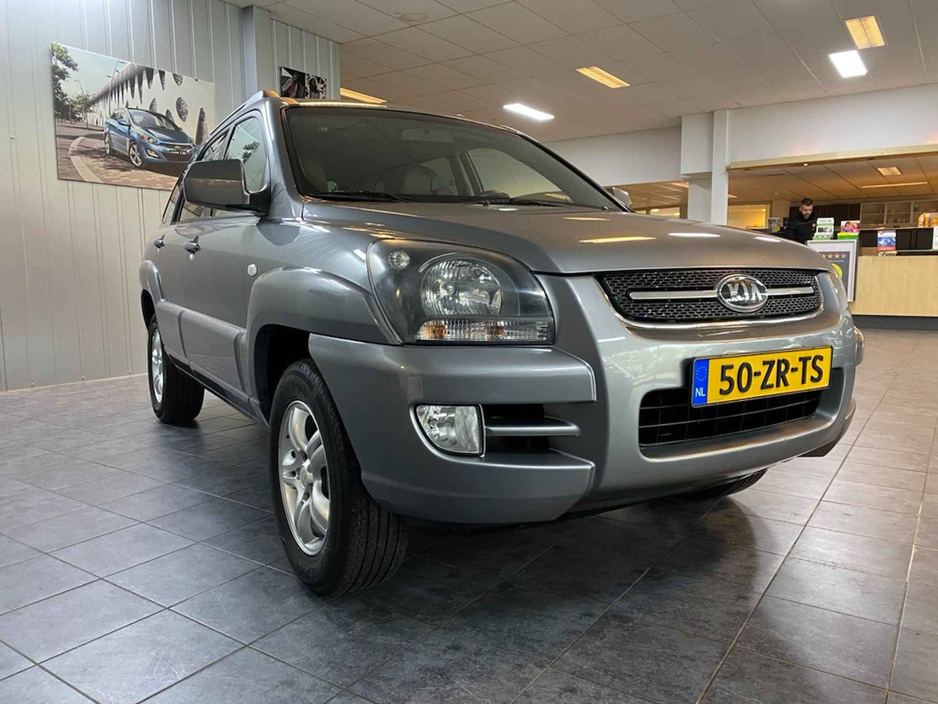 Kia Sportage 2.0 CVVT X-ception In nieuwstaat, Lederen bekleding, Climate control, Cruise control. - 5/19