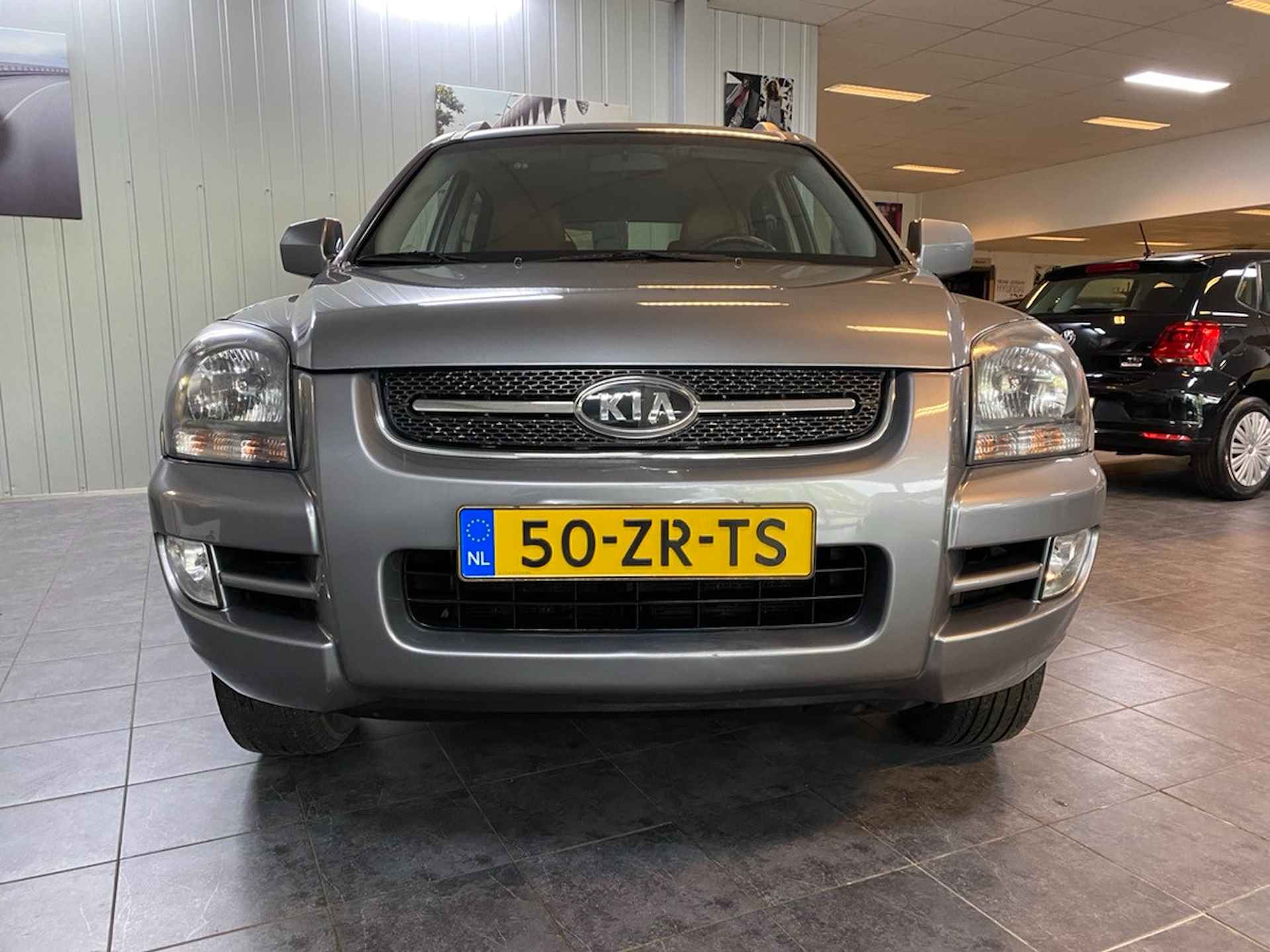 Kia Sportage 2.0 CVVT X-ception In nieuwstaat, Lederen bekleding, Climate control, Cruise control. - 6/19