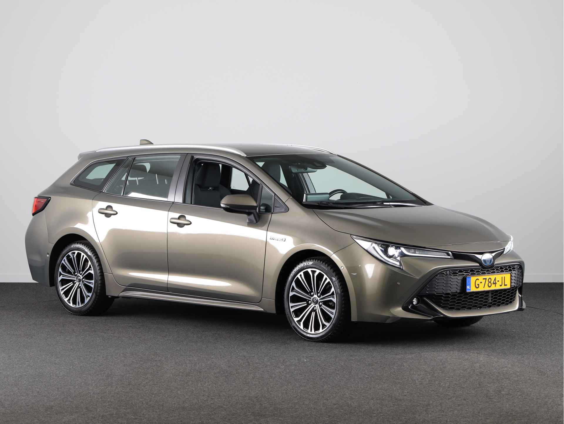 Toyota Corolla Touring Sports 1.8 Hybrid Business Intro | Trekhaak | Head-up Display | Parkeersensoren | Navigatie | Stoelverwarming | Draadloze telefoonlader | - 17/39