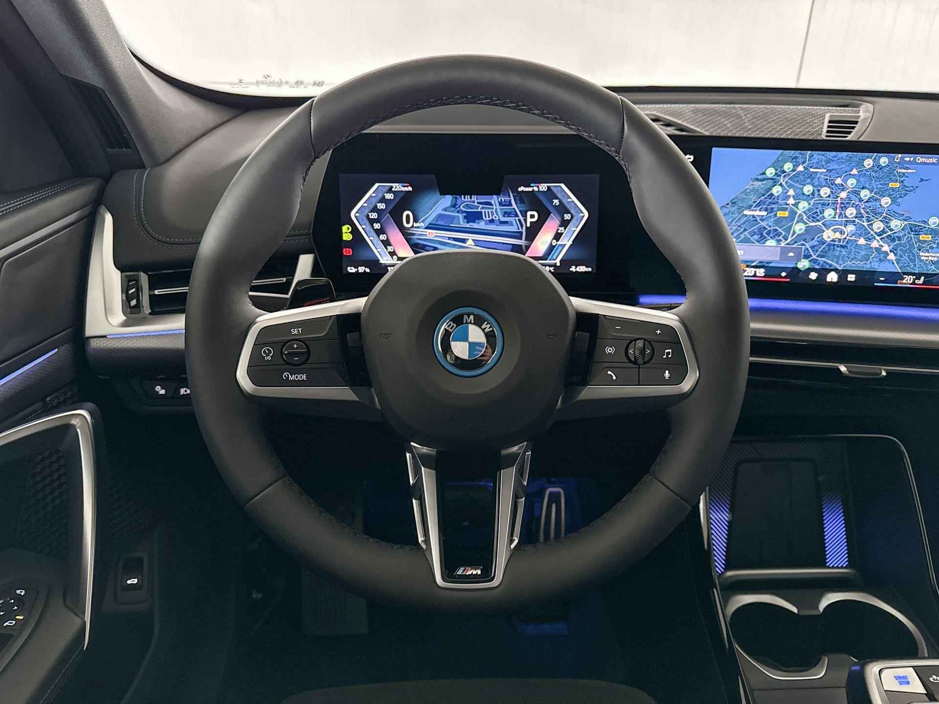 BMW iX1 eDrive20 67 kWh | Glazen panoramadak | Stuurwielrand verwarmd - 12/22