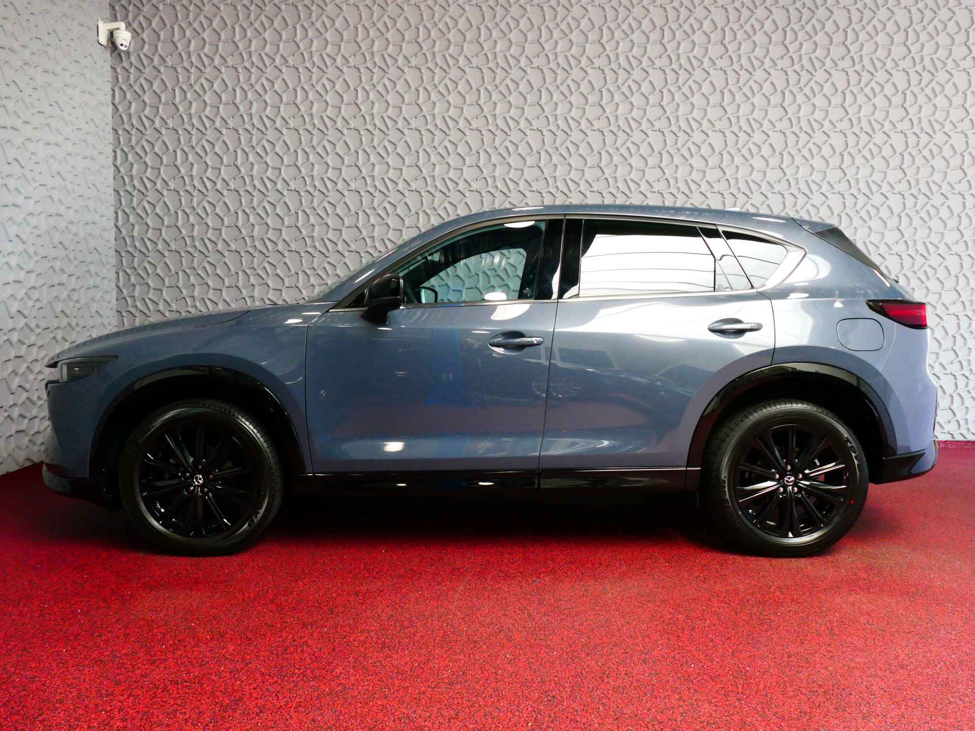 Mazda CX-5 E-SKYACTIV MHEV 2.0 165 PK HOMURA LEER BOSE ELEK.KLEP HEADUP 360.CAMERA 19''LMV FULL LED CARPLAY NAVI STOEL/STUUR VERW. STOELKOE 05/2024 - 65/79