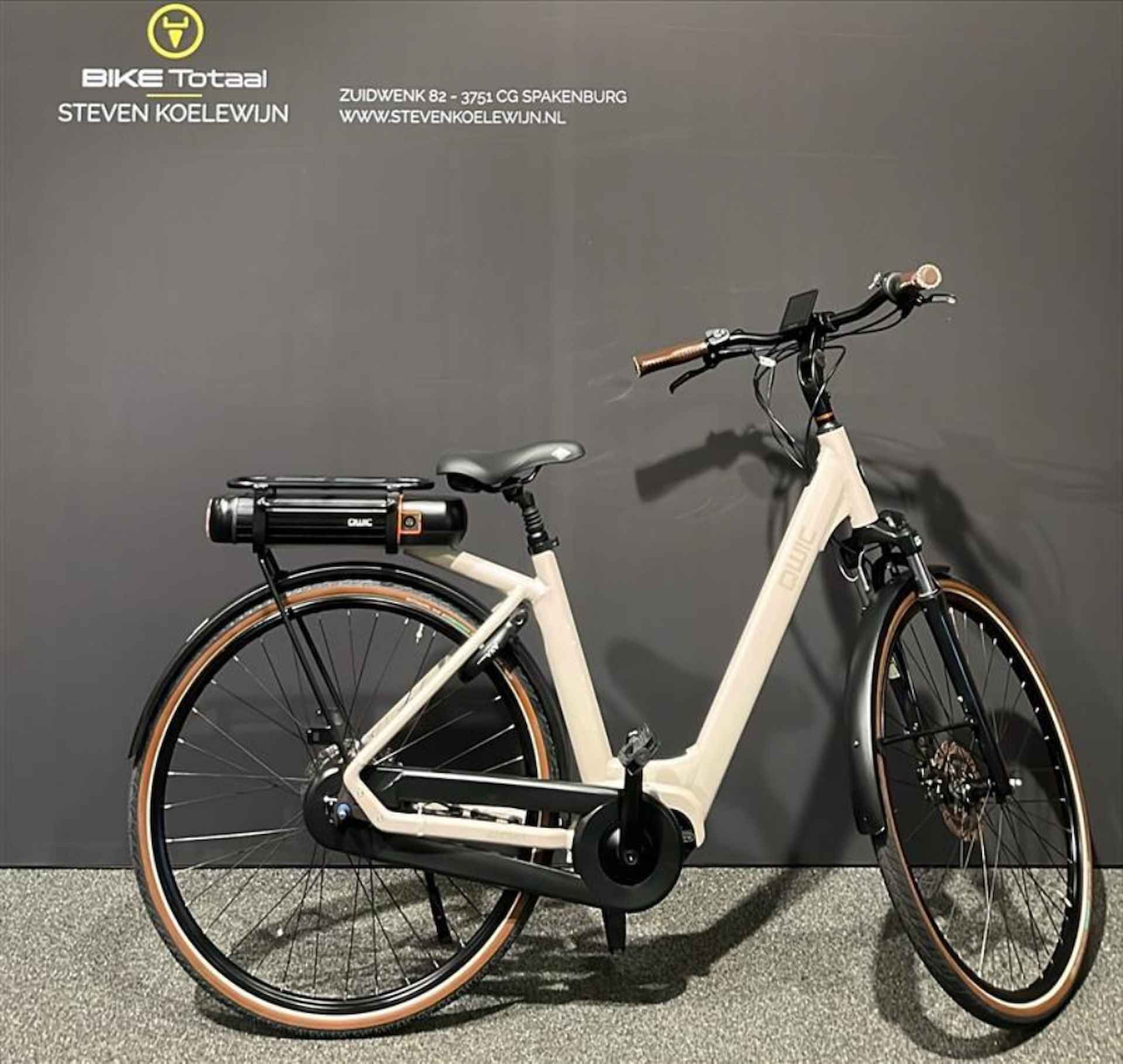 Qwic Premium MN7D+ D49 N7 Elektrische Stadsfietsen maple sand