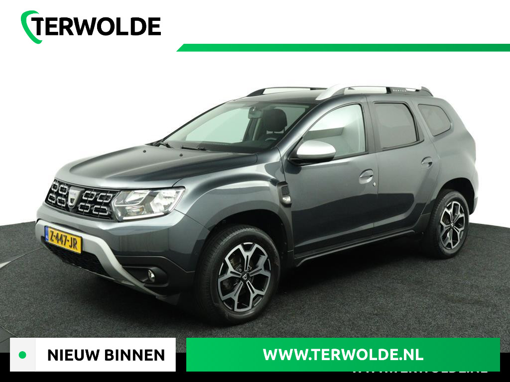 Dacia Duster 1.3 TCe Prestige | Trekhaak | 360 Camera | Navigatie | Stoelverwarming | Dode Hoek Detectie | Getint Glas | Metallic Lak | LED | Licht Metalen Velgen | Keyless Entry | Incl. Winterset |