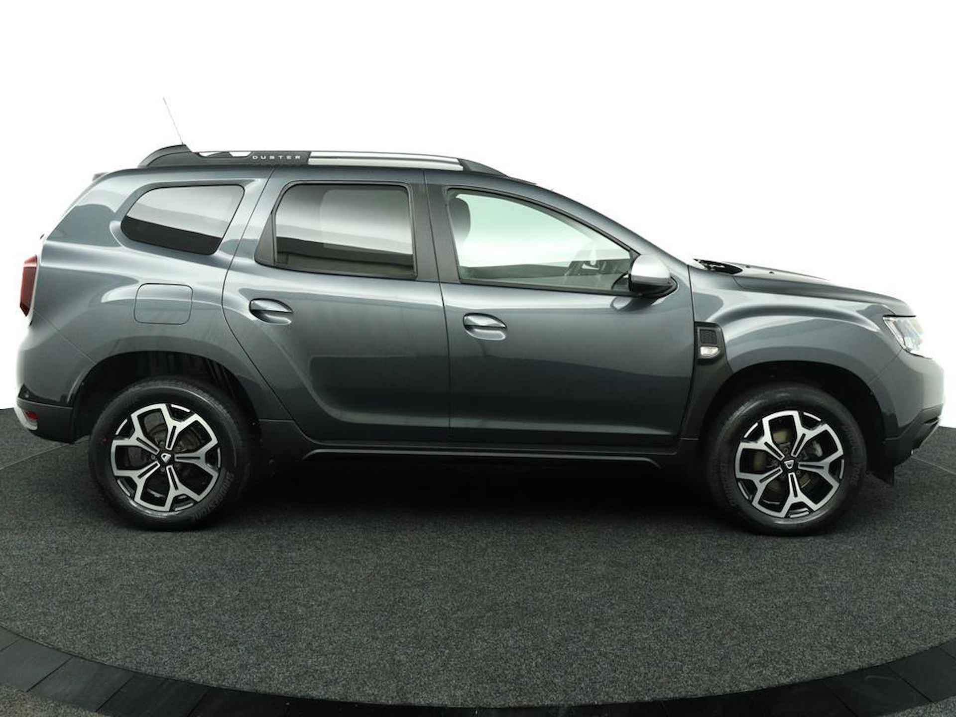 Dacia Duster 1.3 TCe Prestige | Trekhaak | 360 Camera | Navigatie | Stoelverwarming | Dode Hoek Detectie | Getint Glas | Metallic Lak | LED | Licht Metalen Velgen | Keyless Entry | Incl. Winterset | - 7/48