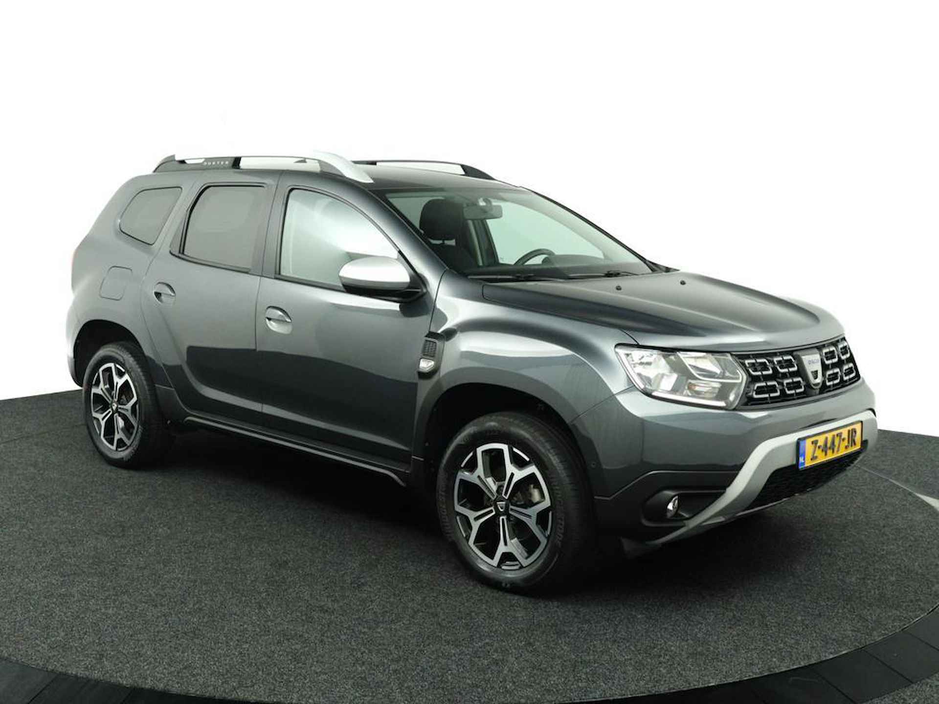 Dacia Duster 1.3 TCe Prestige | Trekhaak | 360 Camera | Navigatie | Stoelverwarming | Dode Hoek Detectie | Getint Glas | Metallic Lak | LED | Licht Metalen Velgen | Keyless Entry | Incl. Winterset | - 8/48