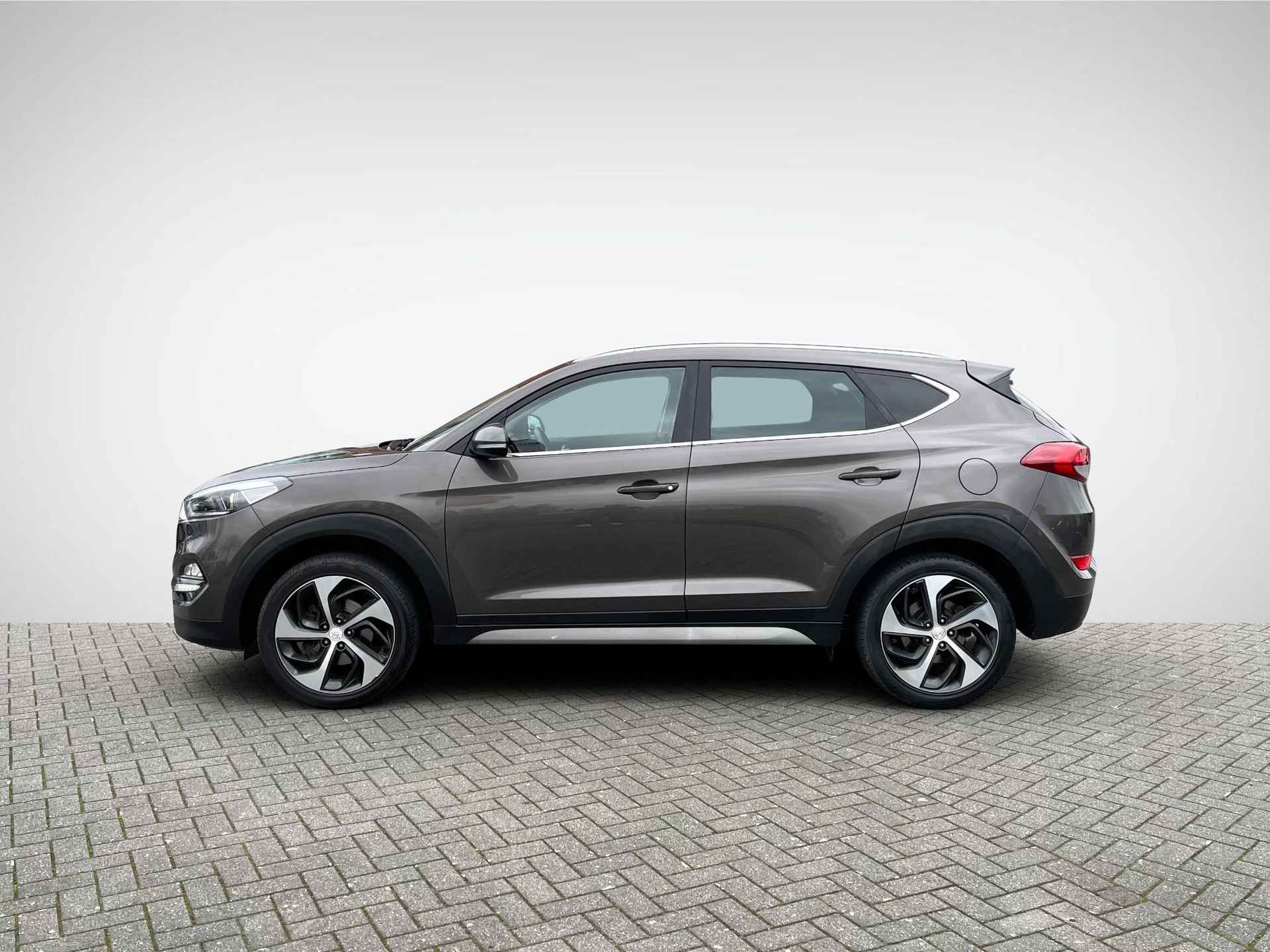 Hyundai Tucson 1.6 GDi Comfort | Trekhaak | Navigatie | Camera | Stoelverwarming | Cruise & Climate Control | 19'' Velgen | Rijklaarprijs! - 7/27