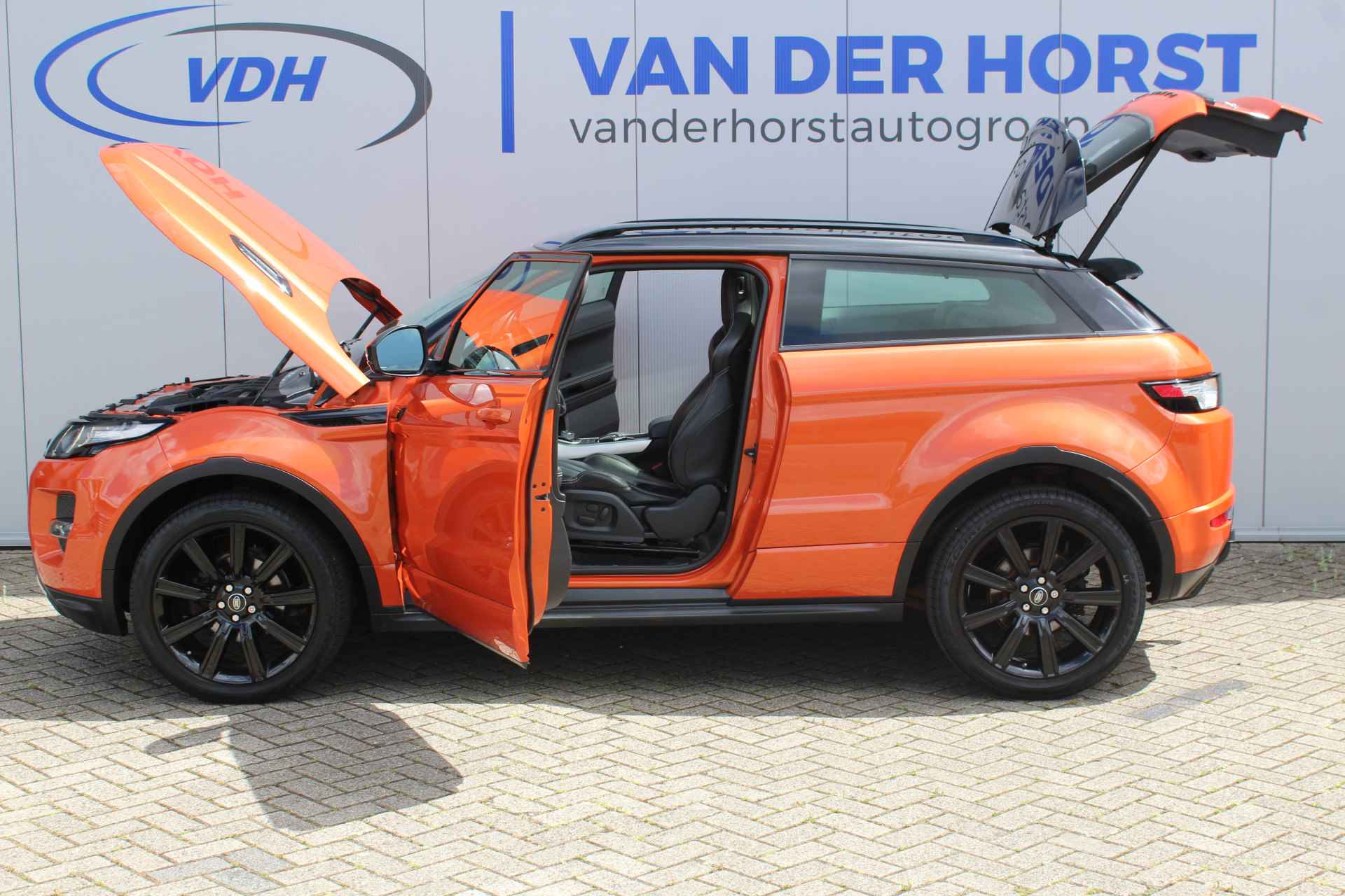 Land Rover Range Rover Evoque Coupé 2.0-240pk Si 4WD Sicilian Yellow. AUTOMAAT ! Bijzonder mooie verschijning deze Range Rover Evoque. Lederen interieur, climate control, Trekhaak, 20" LM wielen, Camera, Parkeersensoren, Sportstoelen, Metallic lak etc etc - 6/55