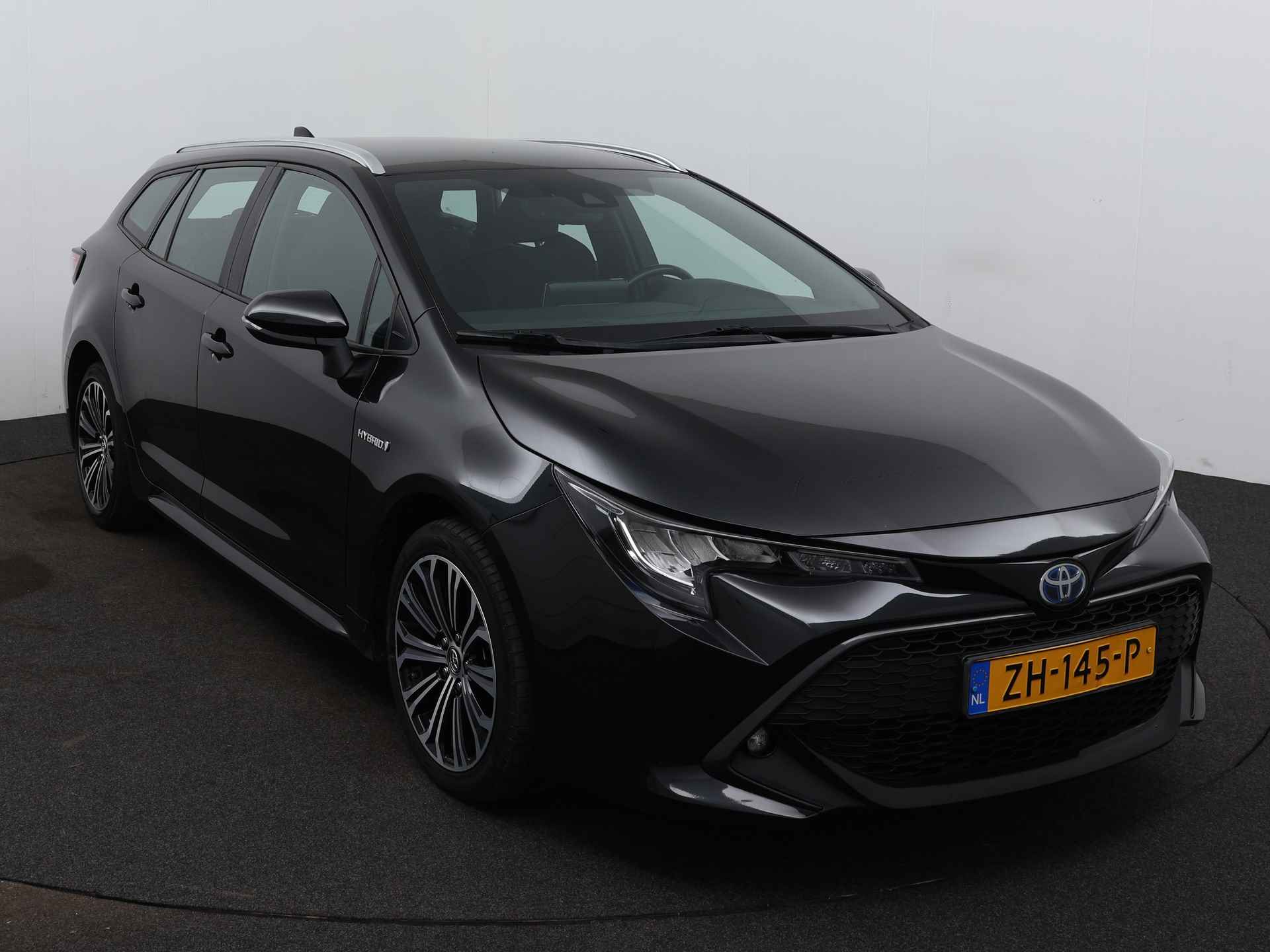 Toyota Corolla Touring Sports 1.8 Hybrid First Edition | Trekhaak | Navigatie | - 27/40