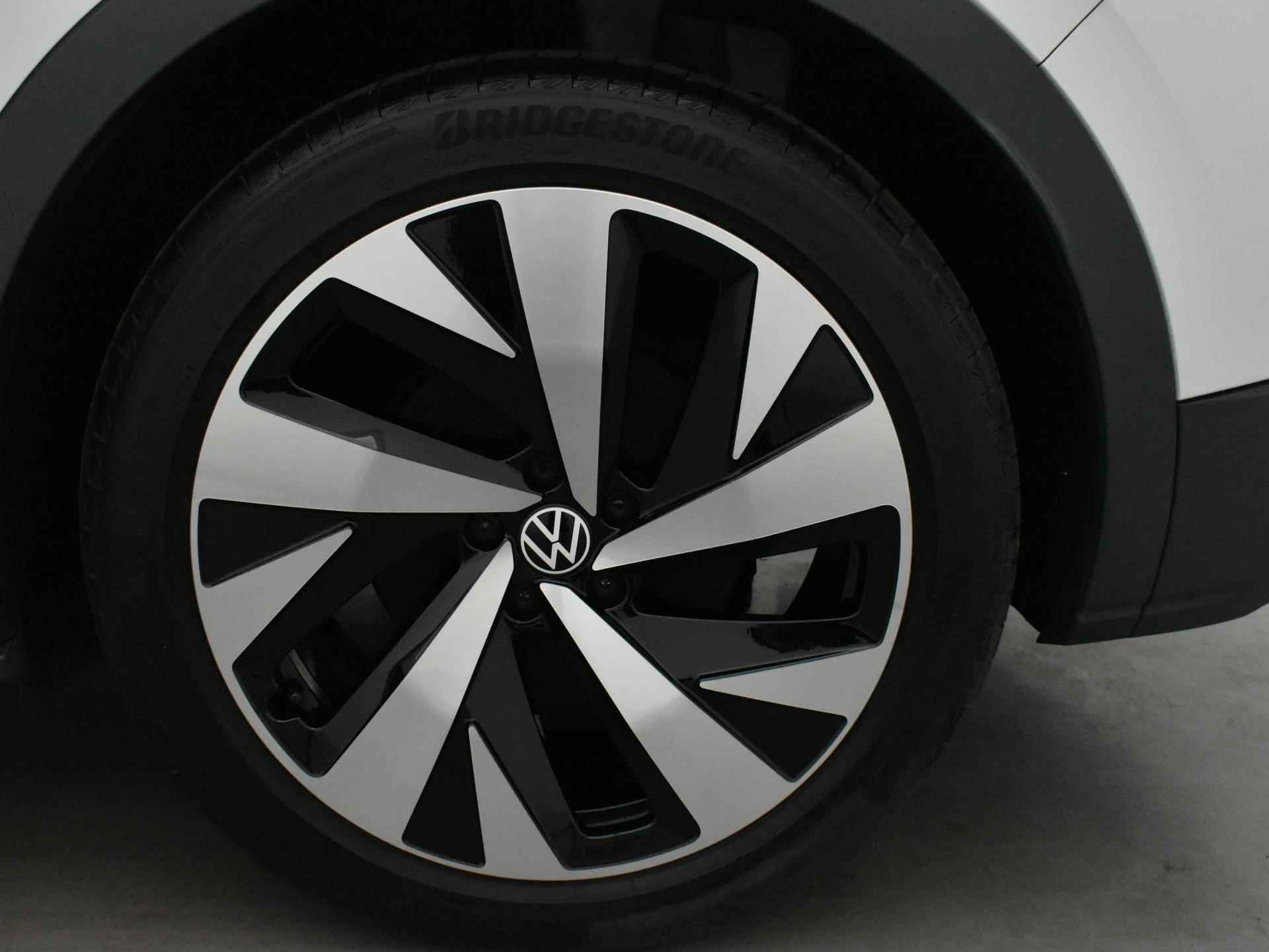 Volkswagen ID.4 First 77 kWh [ Warmtepomp | Navigatie | Camera | Parkeersensoren | Stoelverwarming | Cruise Control Adaptief | Climate Control | Rijprofielen | Apple/Android Carplay | 20'' Lichtmetalen velgen - 21/23