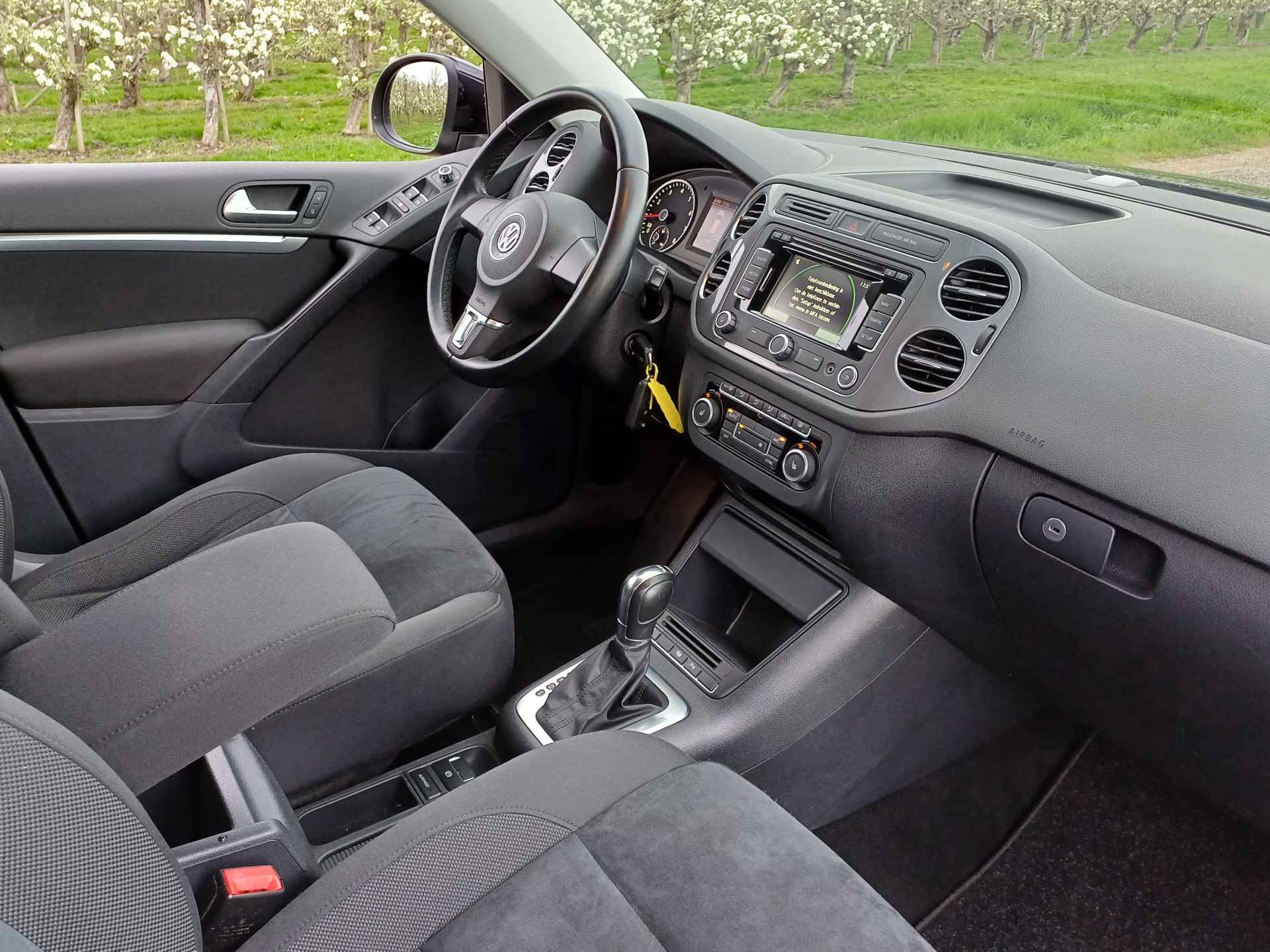 Volkswagen Tiguan 2.0 TSI Sport&Style 4Motion Nette auto | Keurig onderhoud | Navi | Cruise | Parkeerhulp V+A - 28/39