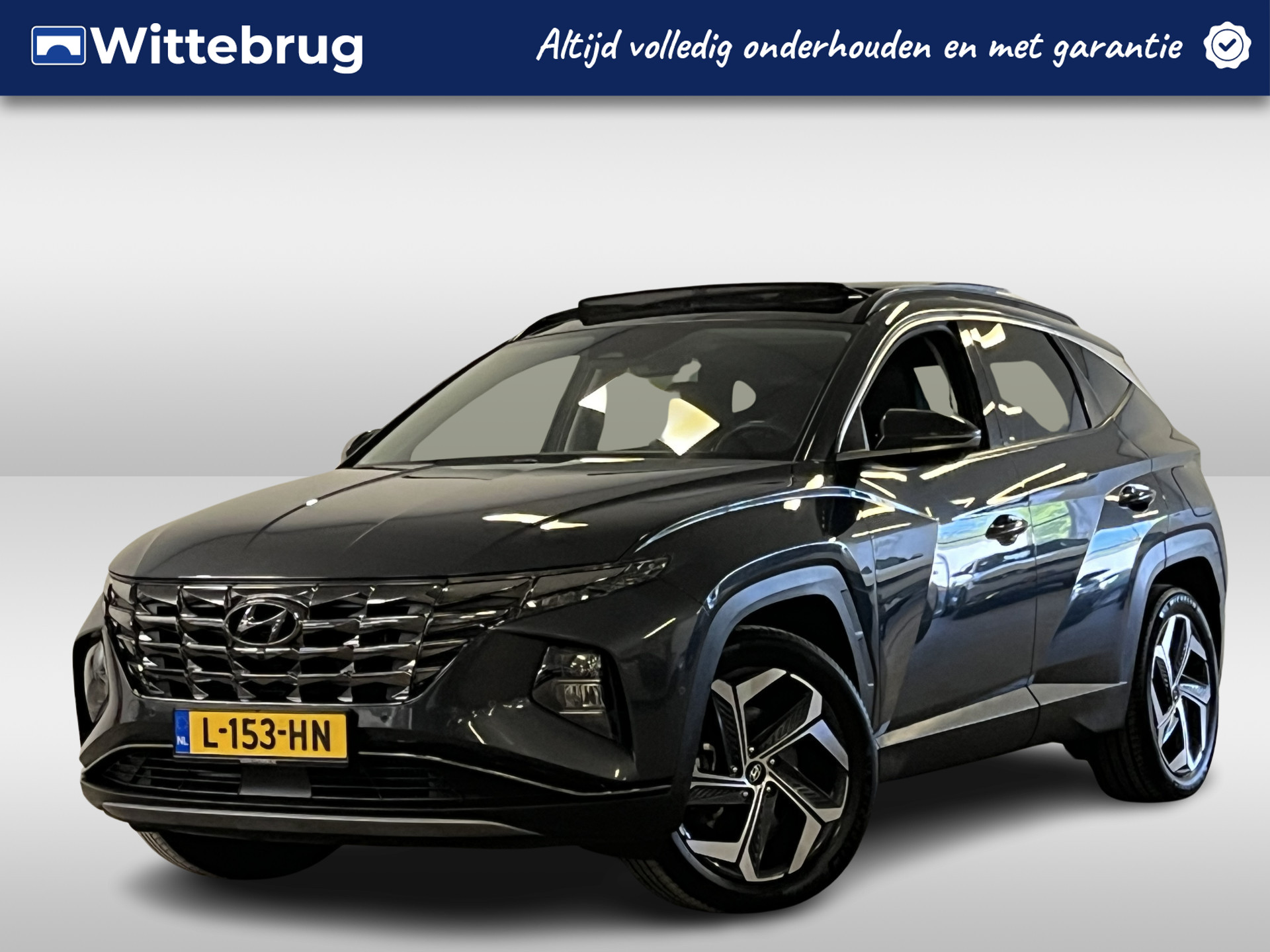 Hyundai Tucson 1.6 T-GDI HEV Premium Sky OPEN DAK !! LEDER !!! bij viaBOVAG.nl