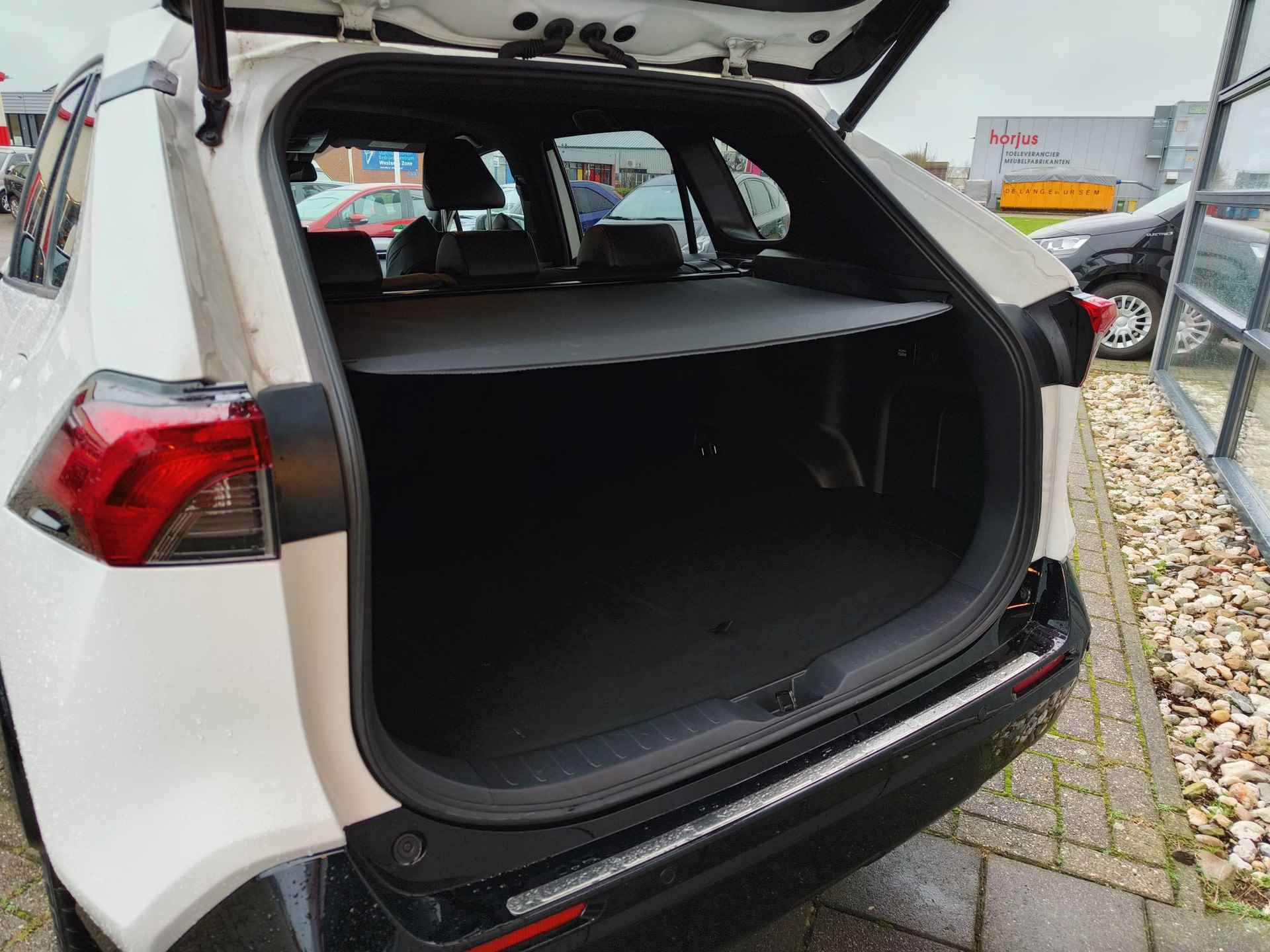 Toyota RAV4 2.5 Plug-in Hybrid AWD Style Limited | Trekhaak | HUD | JBL | Stoel & stuurverwarming | 360 Camera - 9/28