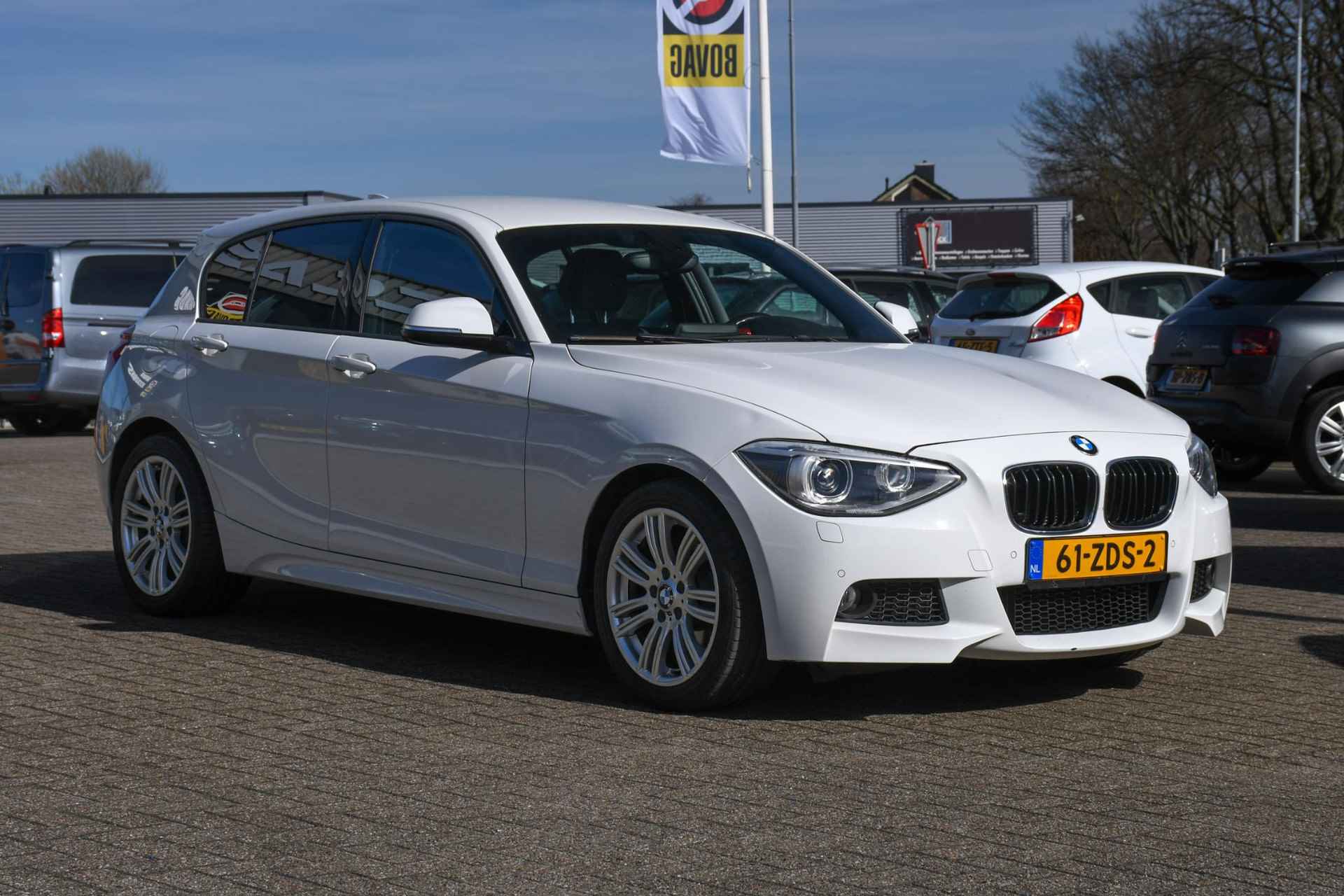 BMW 1-serie 114i Business+ NAVIGATIE/ LEDER/ LM 17/ PDC - 3/31