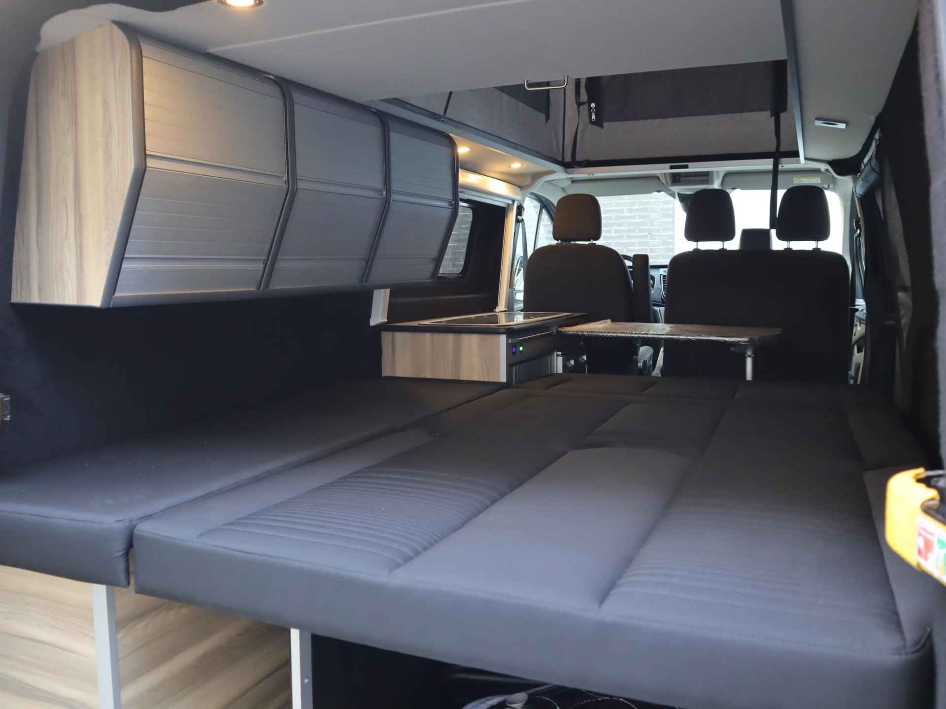 Ford Transit Custom 2.0 TDCI L2H1 Limited Camper 170pk automaat | Camper met 2 slaapplaatsen | Extra breed bed | Keuken met gootsteen- koelkast- gasfornuis | Zonnescherm | Cruise control | Trekhaak | Extra opbergruimte | Stoelverwarming | Voorruitverwarming | Navigatie - 43/56