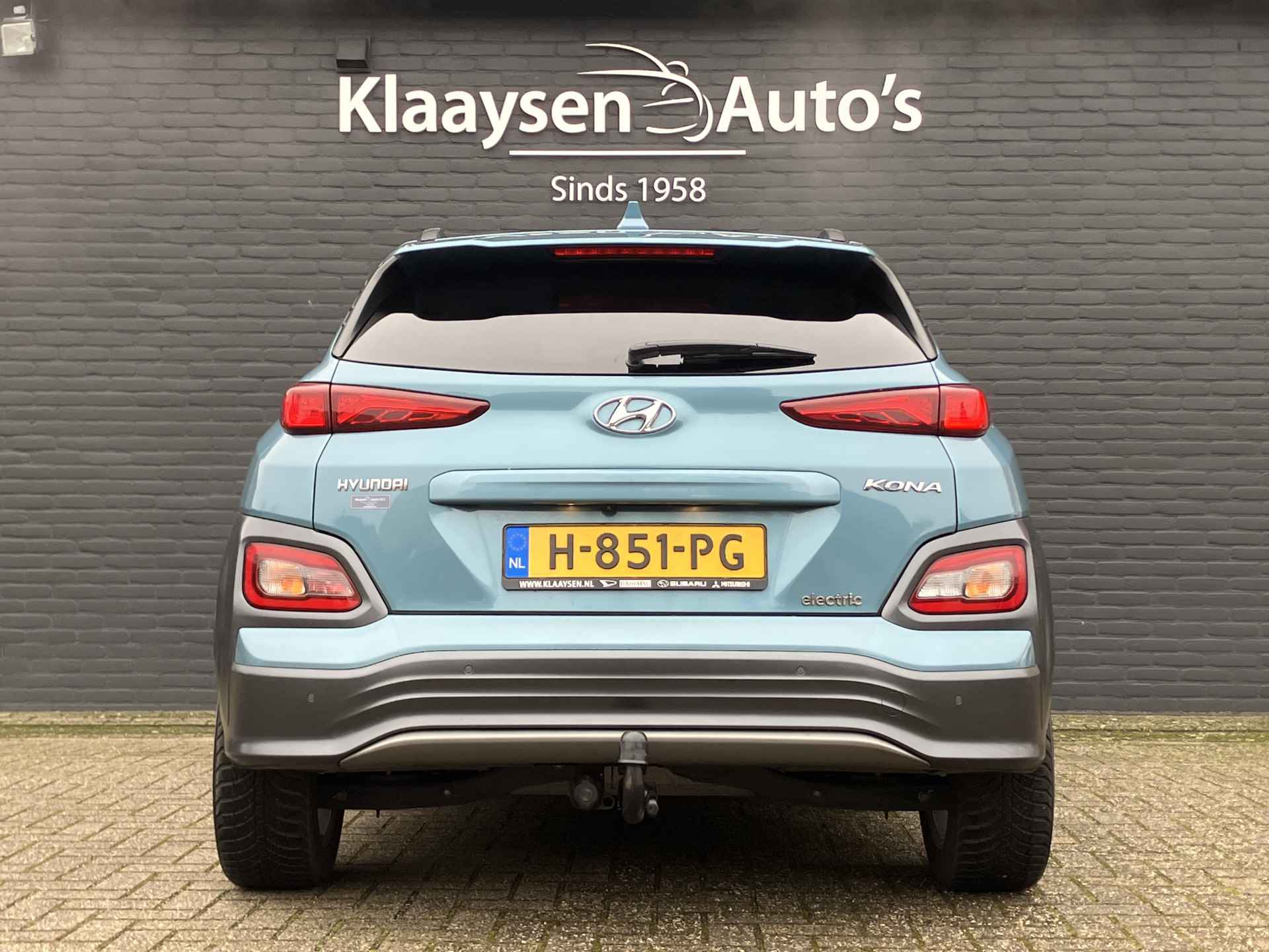 Hyundai KONA EV Premium 64 kWh | dealer onderhouden | leder | navigatie | stoel/stuurverw. | adapt. cruise | trekhaak | incl. zomerset - 7/40