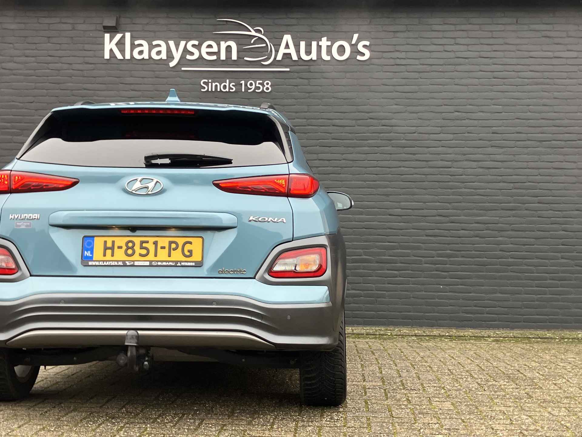 Hyundai KONA EV Premium 64 kWh | dealer onderhouden | leder | navigatie | stoel/stuurverw. | adapt. cruise | trekhaak | incl. zomerset - 14/40