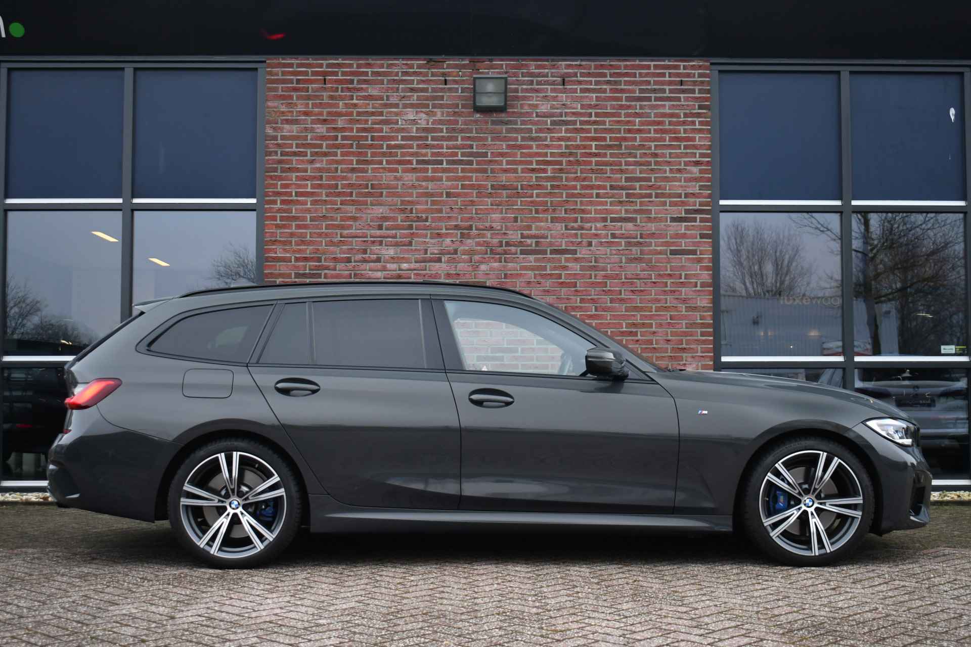 BMW 3 Serie Touring M340i xDrive Pano ACC H/K Laser Standk HUD Adp-onderstel El-zetels - 42/97