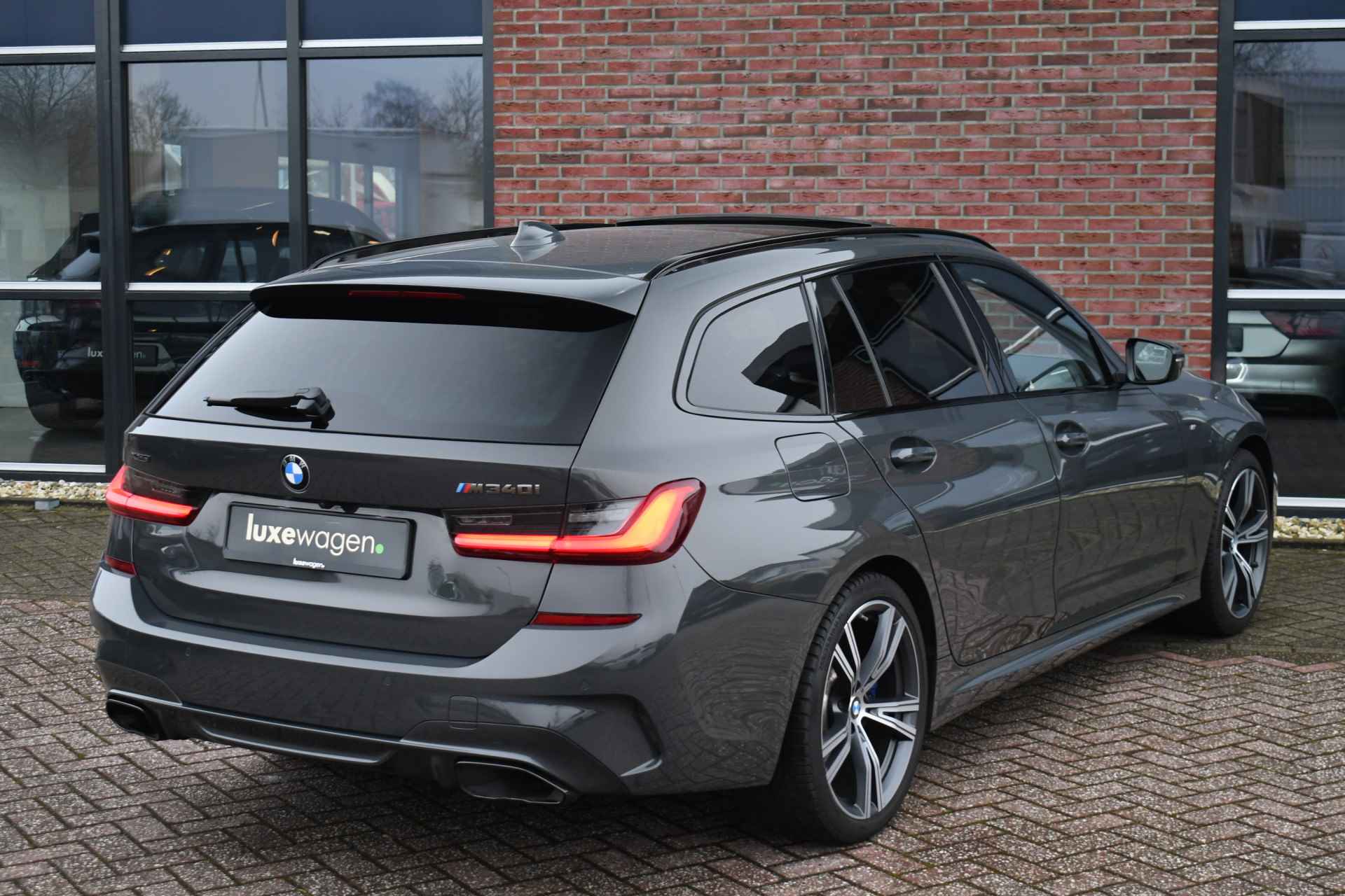 BMW 3 Serie Touring M340i xDrive Pano ACC H/K Laser Standk HUD Adp-onderstel El-zetels - 52/97