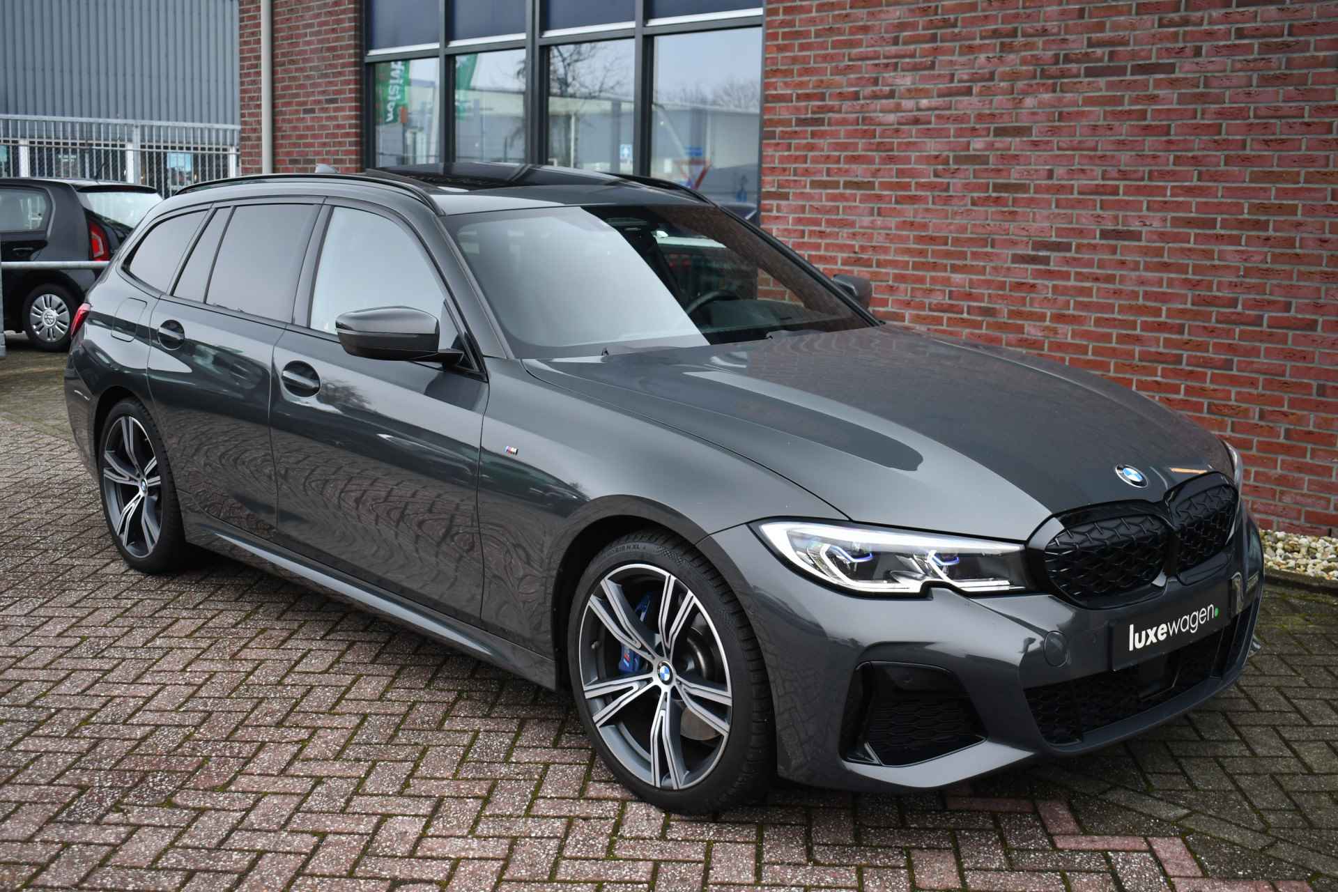 BMW 3 Serie Touring M340i xDrive Pano ACC H/K Laser Standk HUD Adp-onderstel El-zetels - 71/97