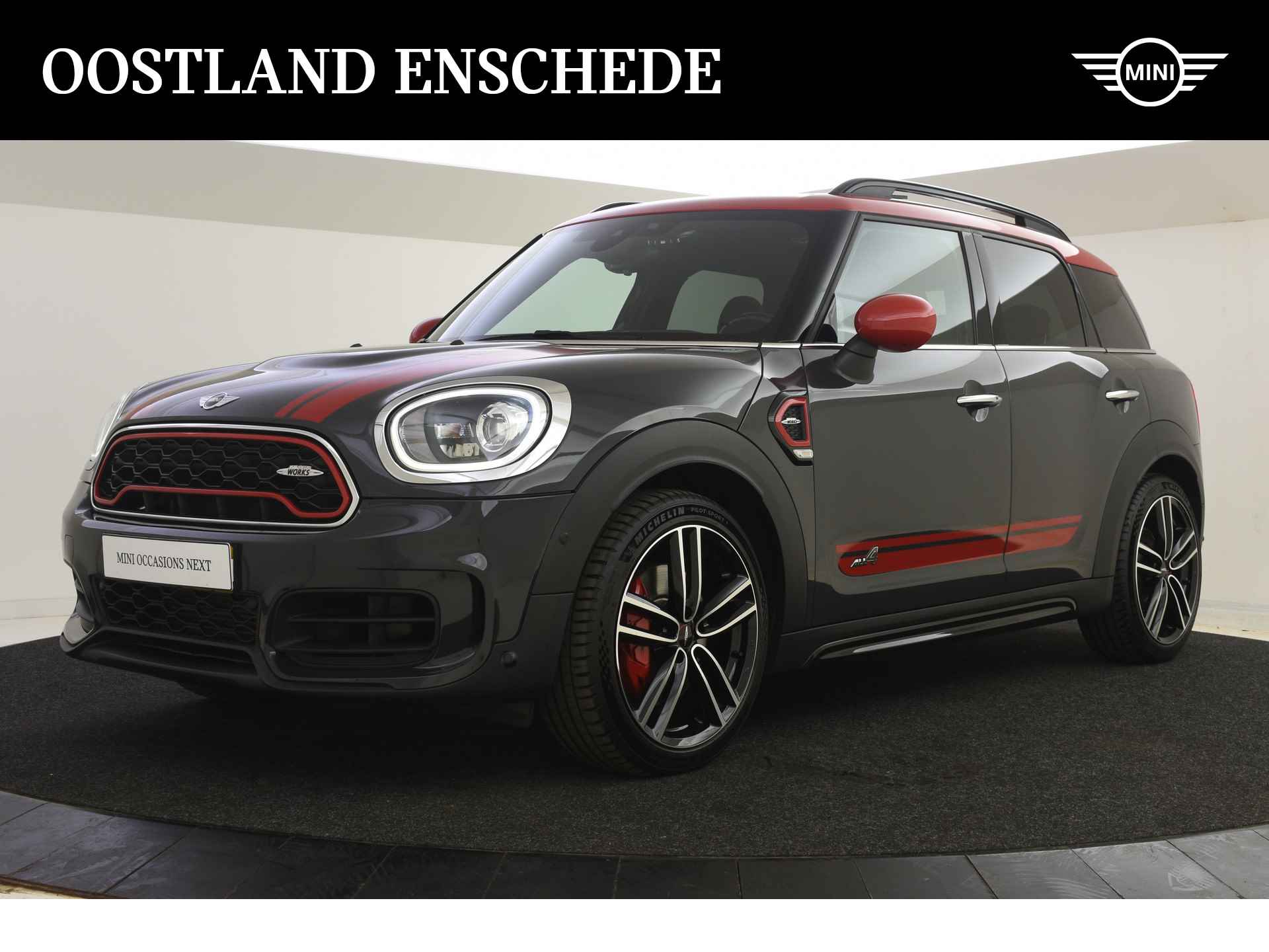 MINI Countryman JCW ALL4 Chili Automaat / Panoramadak / Adaptief onderstel / Achteruitrijcamera / LED / Head-Up / Park Assistant / Navigatie Professional / Cruise Control - 1/39