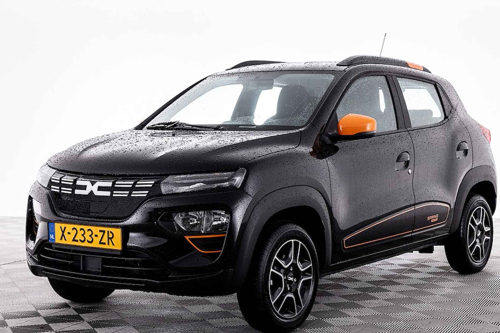 Dacia Spring Expression 27 kWh | NAVI | LEDER ✅ 1e Eigenaar . - 23/28