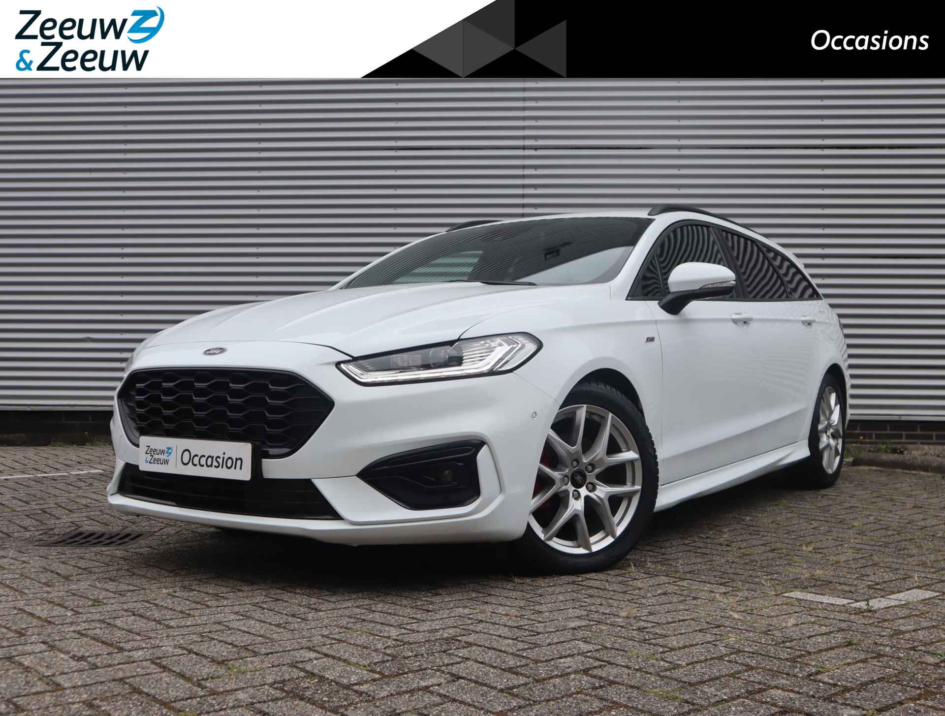 Ford Mondeo Wagon 2.0 IVCT HEV ST-Line | Elektrische Trekhaak | Elektrisch verstelbare voorstoelen | Halfleren bekleding |Stuur- Stoel en Voorruitverwarming | Camera | Apple Carplay & Android Auto | Parkeersensoren voor en achter | Keyless - 1/67